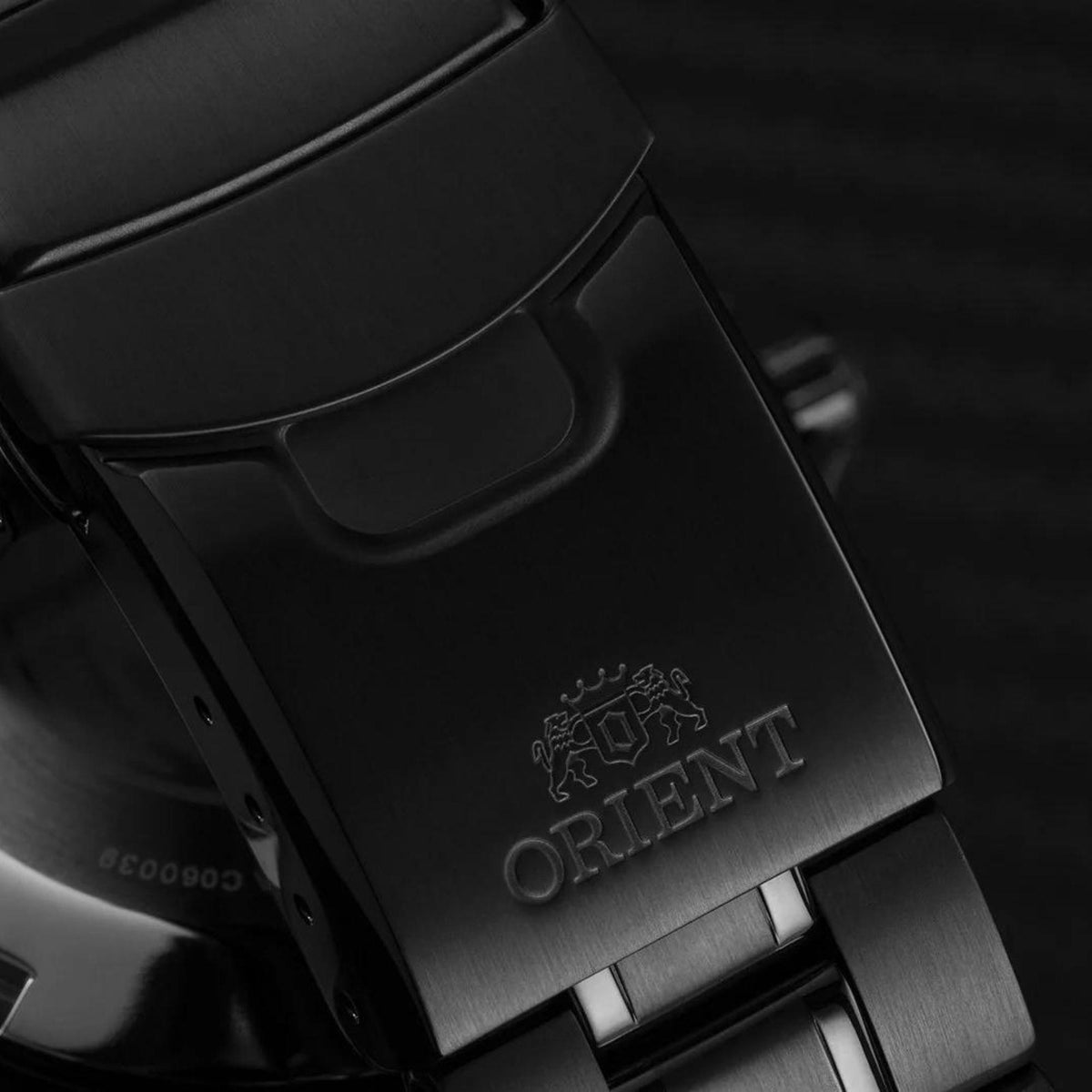 Metal watch clasp with Orient logo on black-strap style deployant buckle