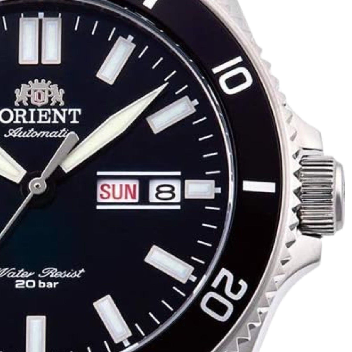 Men's black dial automatic diver watch showing SUN date window and silver bezel markings