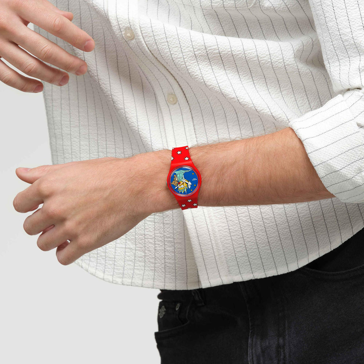 Swatch Little Lady Liberty watch, red star silicone strap and blue dial with crown-side view