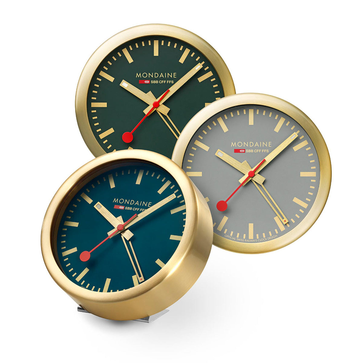 Gold-tone table alarm clock set with green faces and red second hands, three clocks