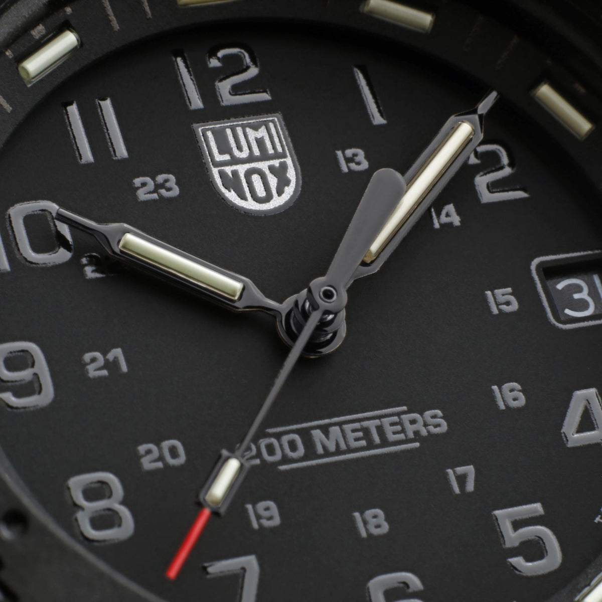 Close-up of the black dial, hands, and date display on the Luminox Navy SEAL 3000 Series XS.3001.EVO.BO.S