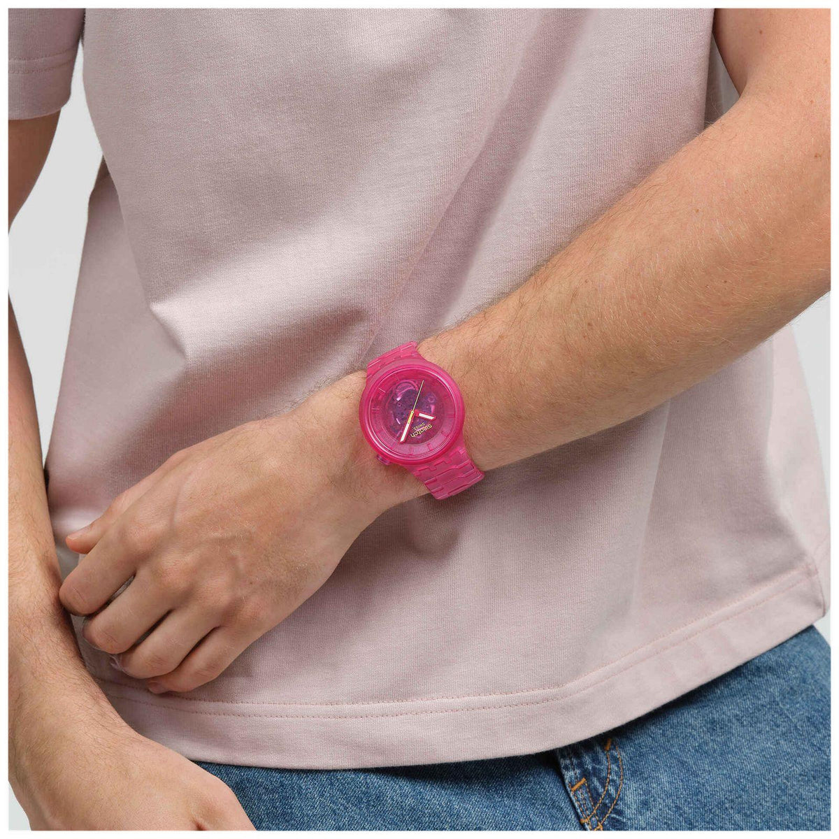 Pink Joy bio-sourced watch on wrist, pink dial and pink translucent strap