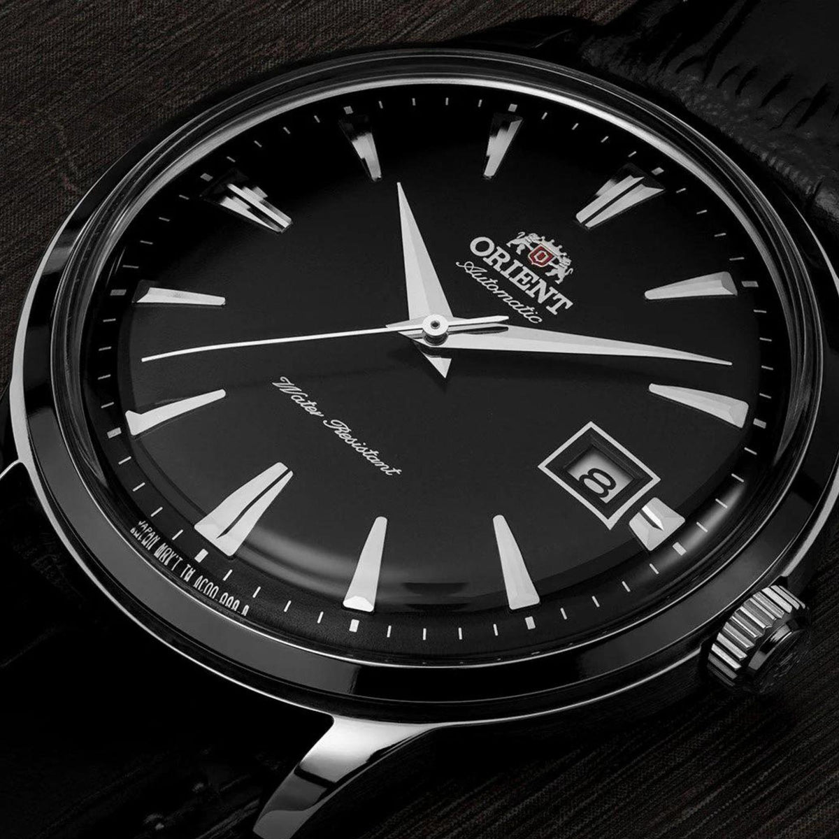 Orient Bambino black dial mens automatic watch with raised hour markers and date window