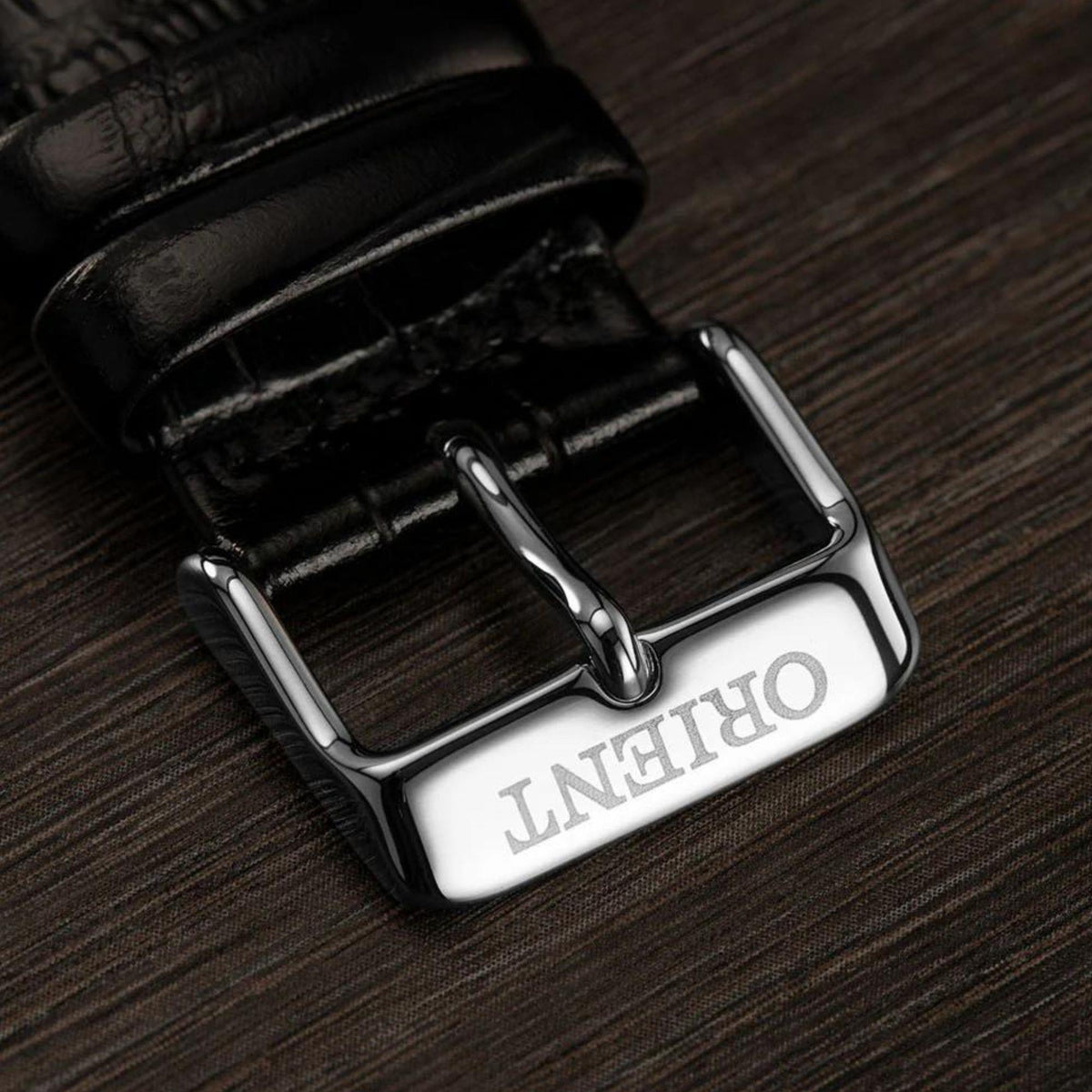 Black leather watch strap with stainless steel buckle and Orient Bambino branding