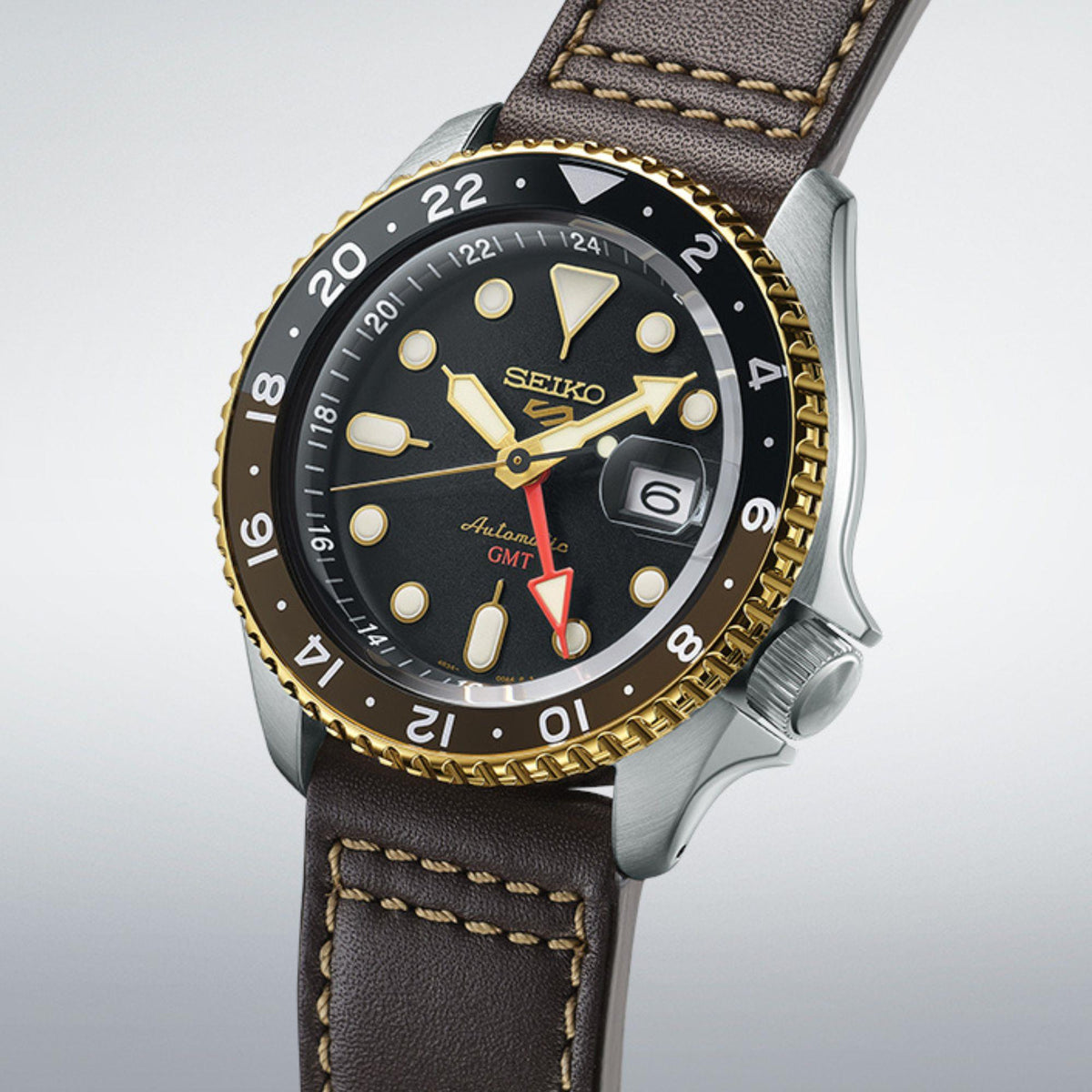 Seiko 5 Sports SKX GMT Mocha SSK036K1 gold-tone fluted bezel detail