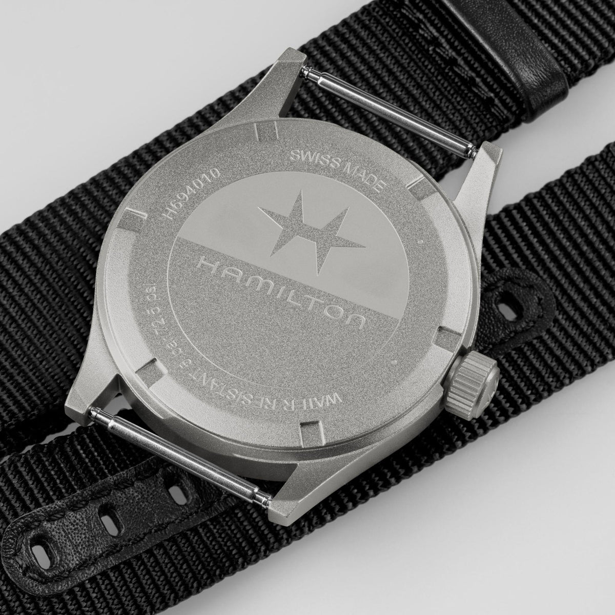 Hamilton Khaki Field H69401430 quartz watch stainless steel caseback view showing engraved brand logo and solid back plate