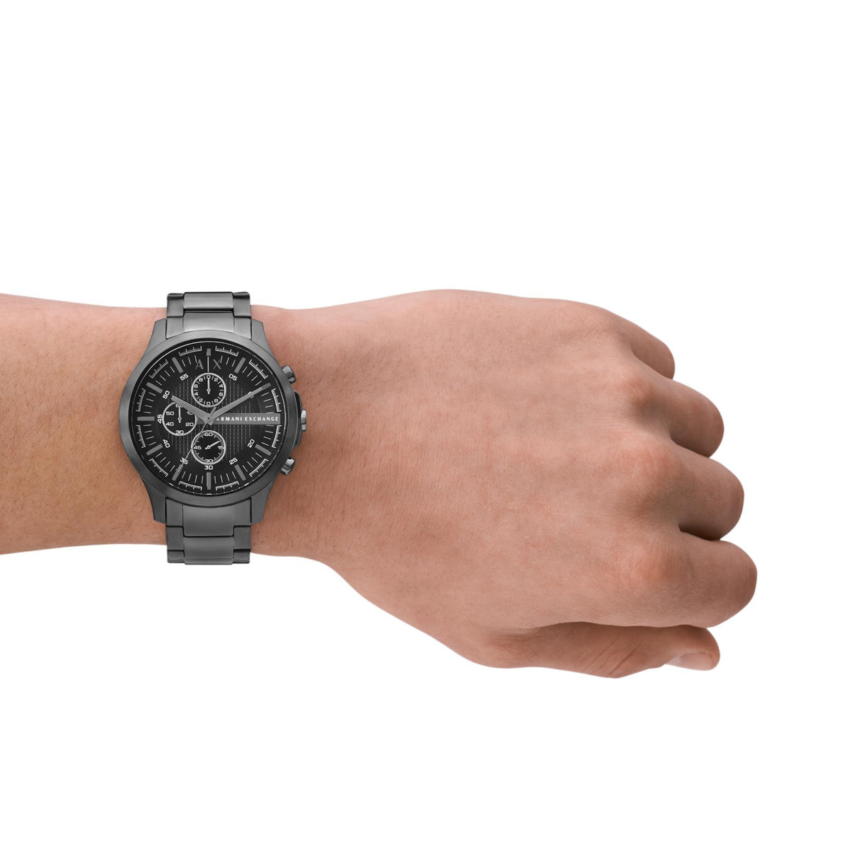 Men's black dial chronograph quartz watch on wrist with steel bracelet