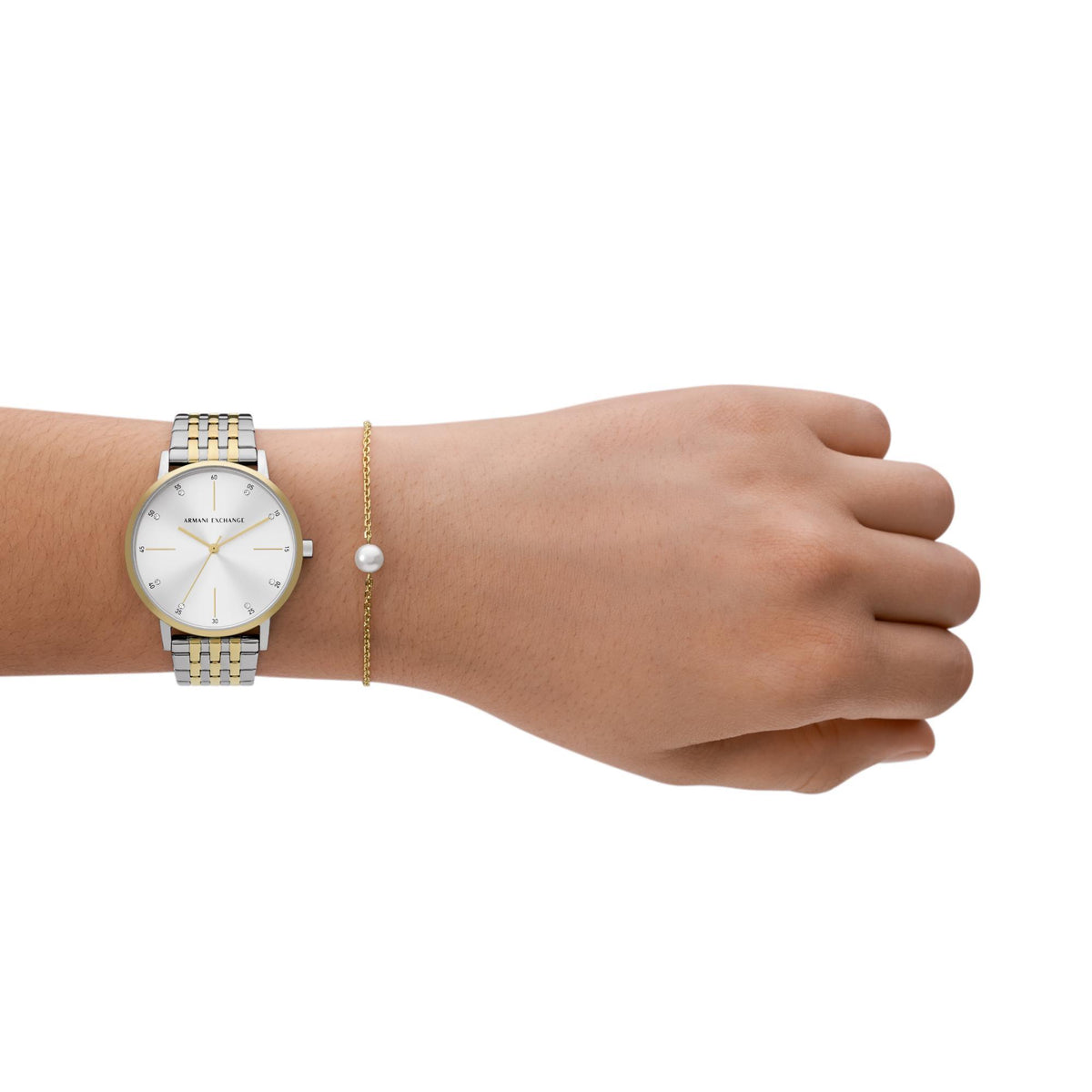 Wristwatch with silver and gold-tone links, white dial, paired with bracelet chain