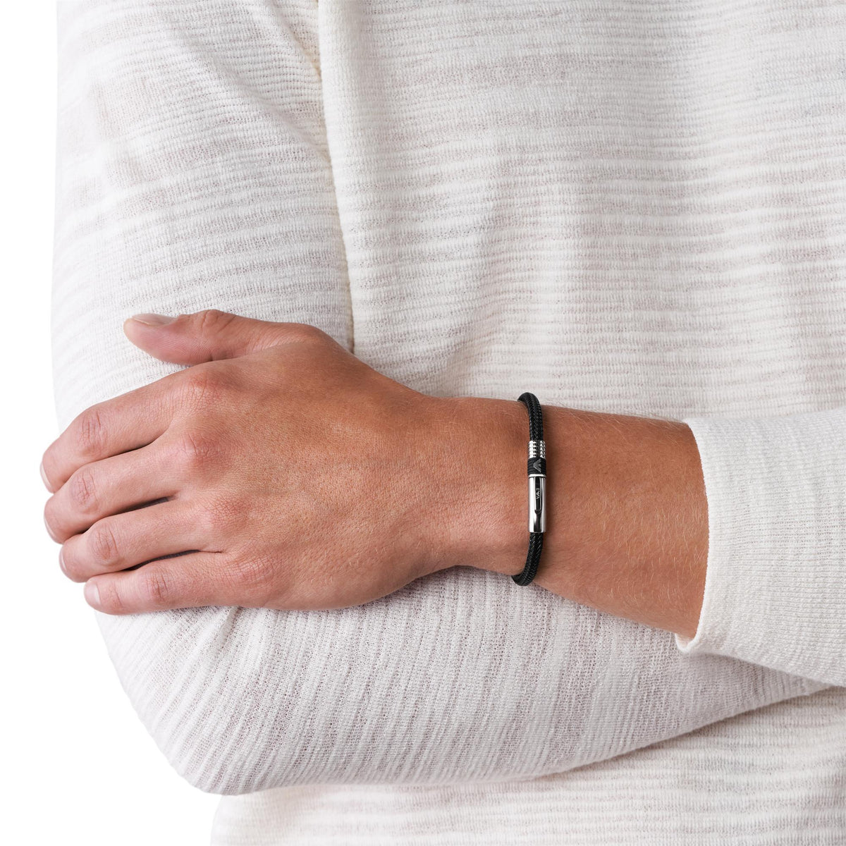 Emporio Armani braided black leather bracelet on wrist with stainless steel clasp
