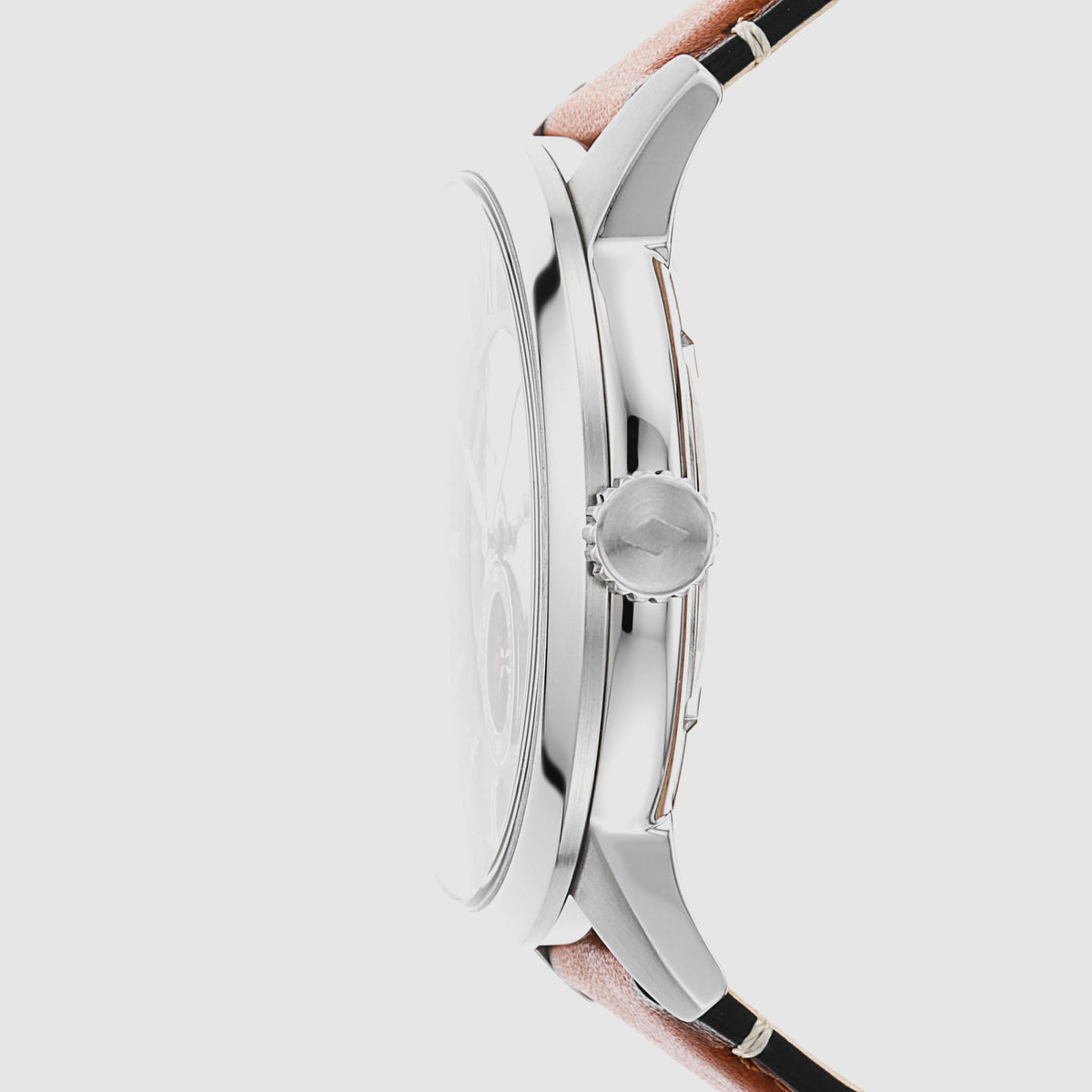 Side profile of the Fossil Townsman ME3154 watch highlighting the polished steel case, textured crown with logo, and brown leather strap attachment