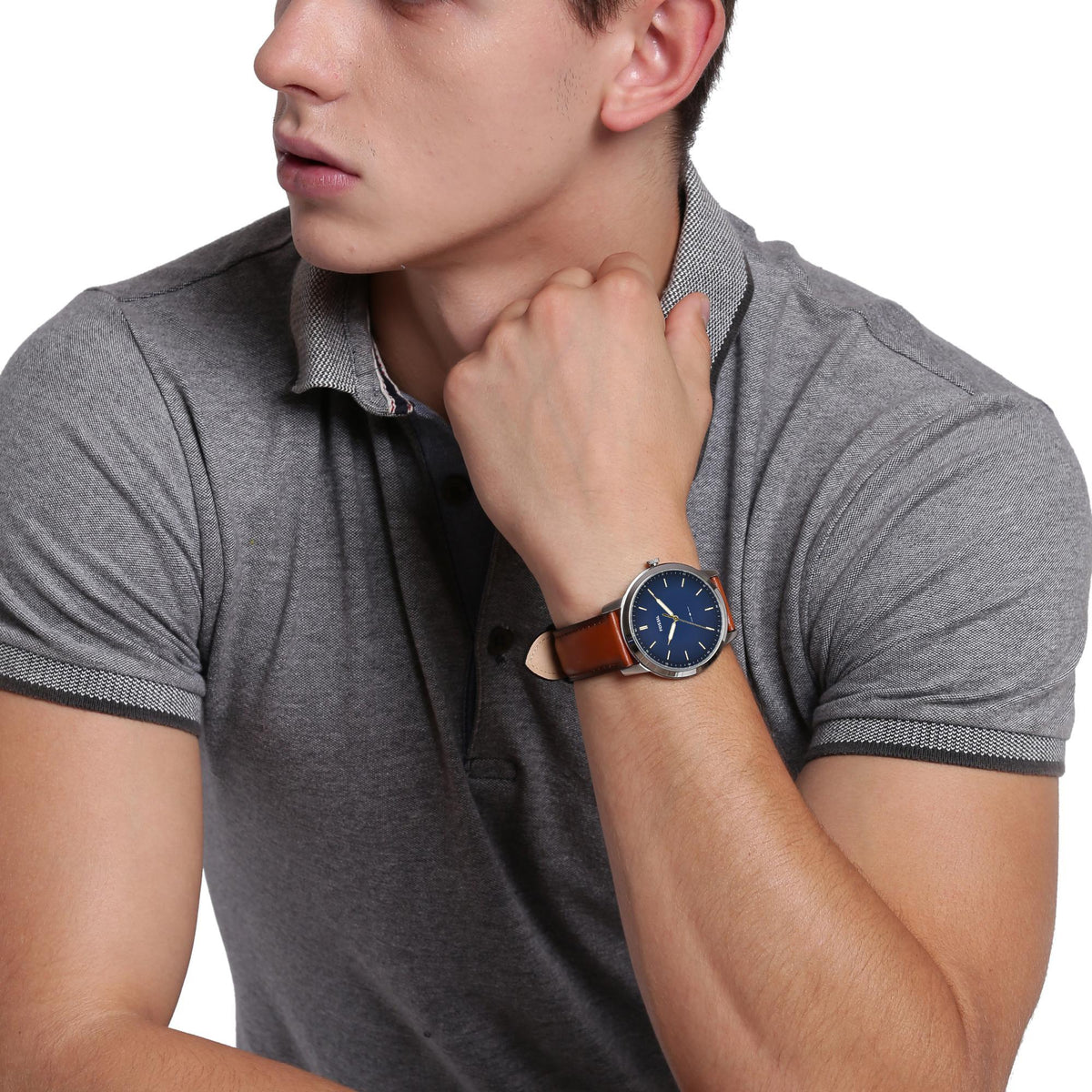 Men's wristwatch on model with blue dial and brown leather strap