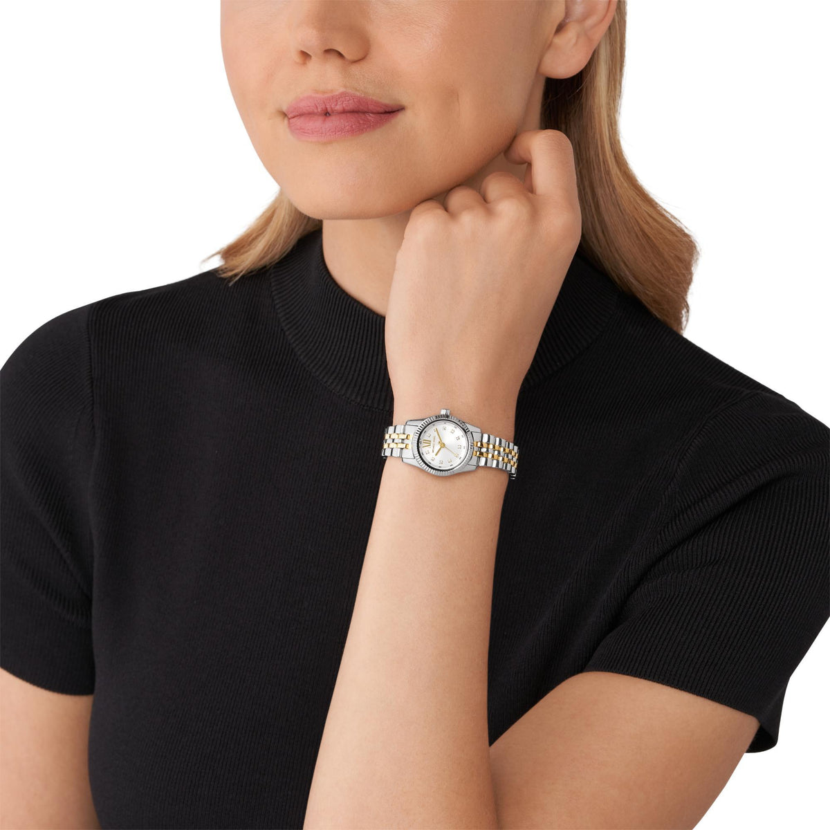 Michael Kors Lexington MK4740 full front view displaying the round white dial with gold-tone hands and two-tone bracelet