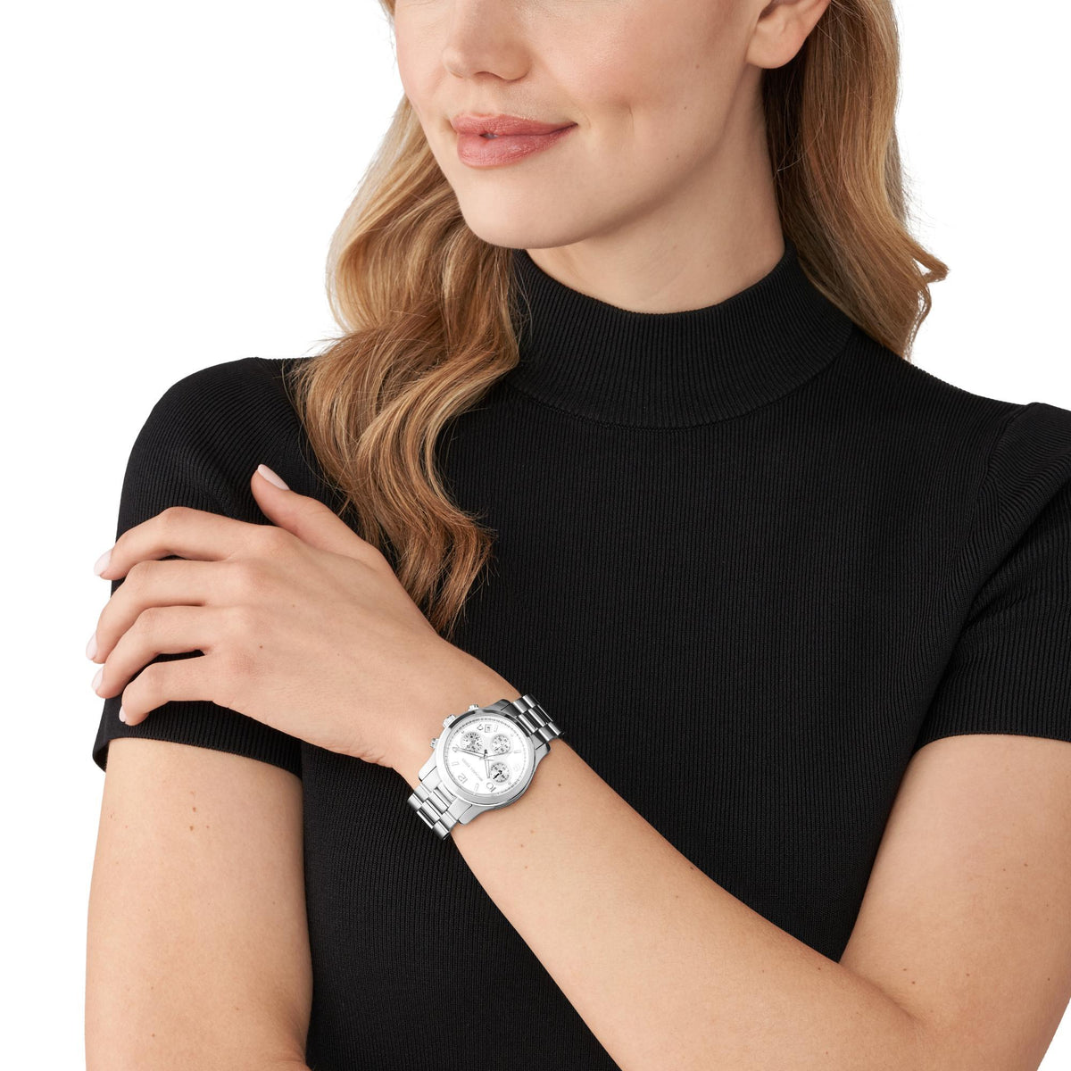 Michael Kors Runway Chronograph MK7325 lifestyle shot showing silver dial women's watch worn on wrist