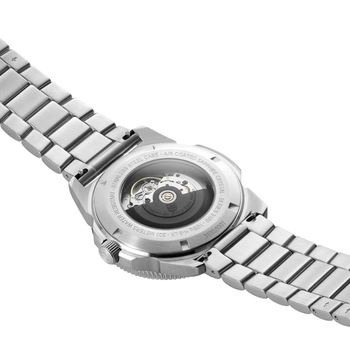 Stainless steel dive watch rear view with ridged bezel and visible movement through back