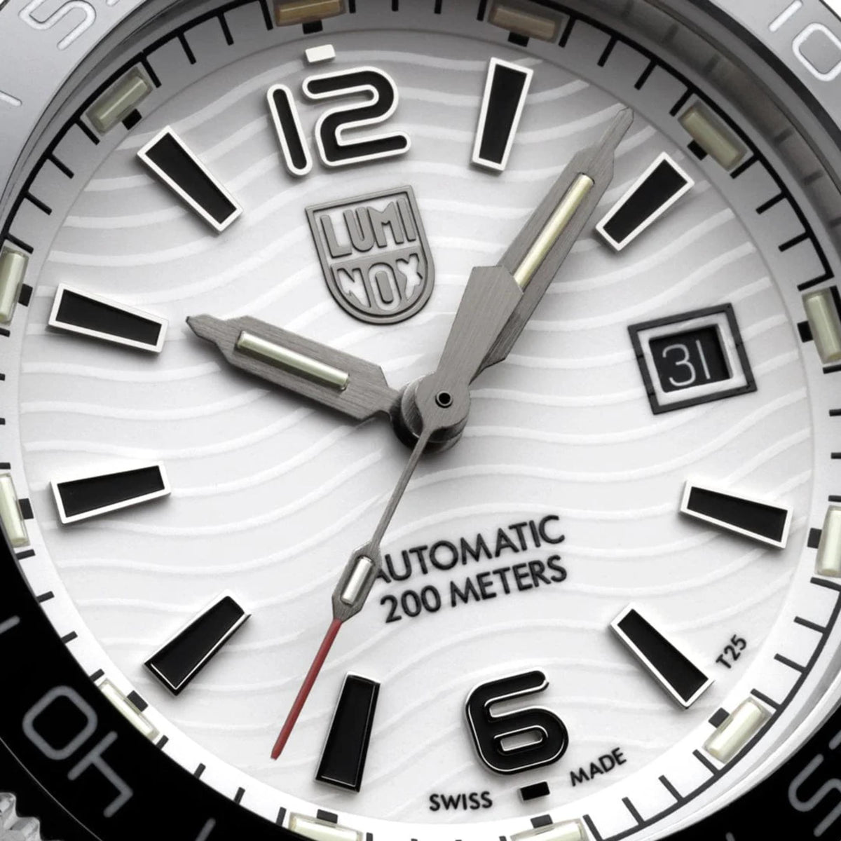 Luminox Pacific Diver watch face close-up with light dial, date window, and luminous hands