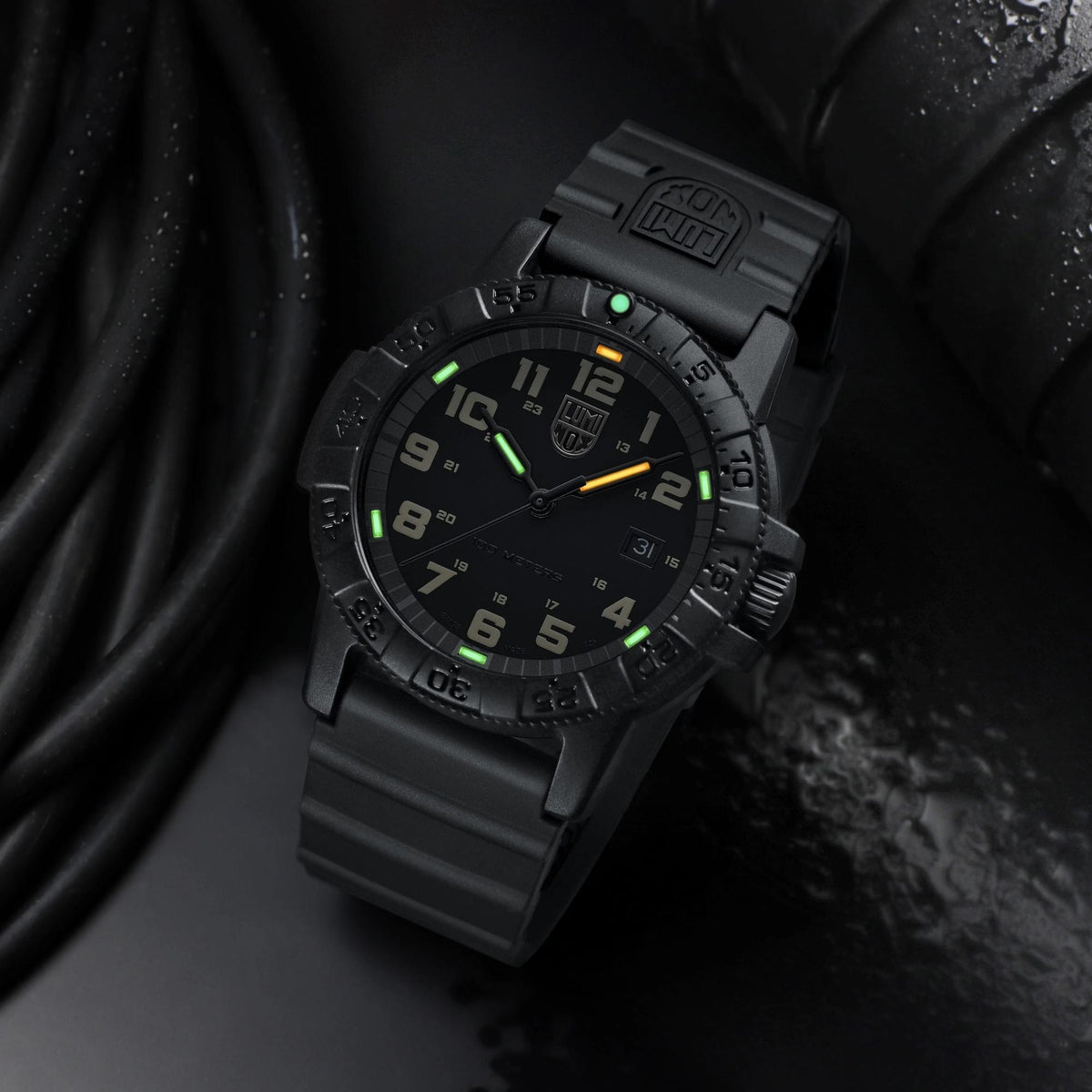 Black Luminox diver-style rubber watch with glowing green bezel markers