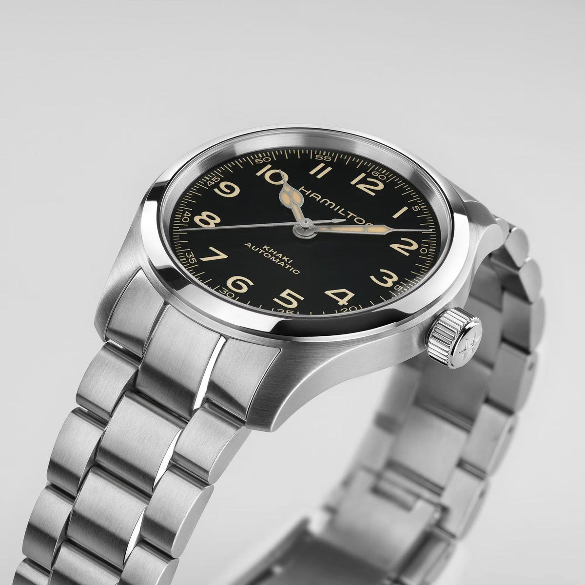 Hamilton Khaki Field Murph H70405130 automatic watch side perspective view highlighting steel case crown and black dial