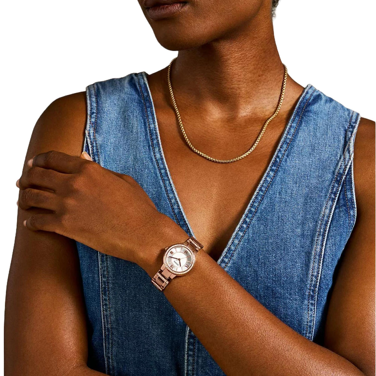 Rose gold-tone ladies watch on wrist with white dial and crystal bezel