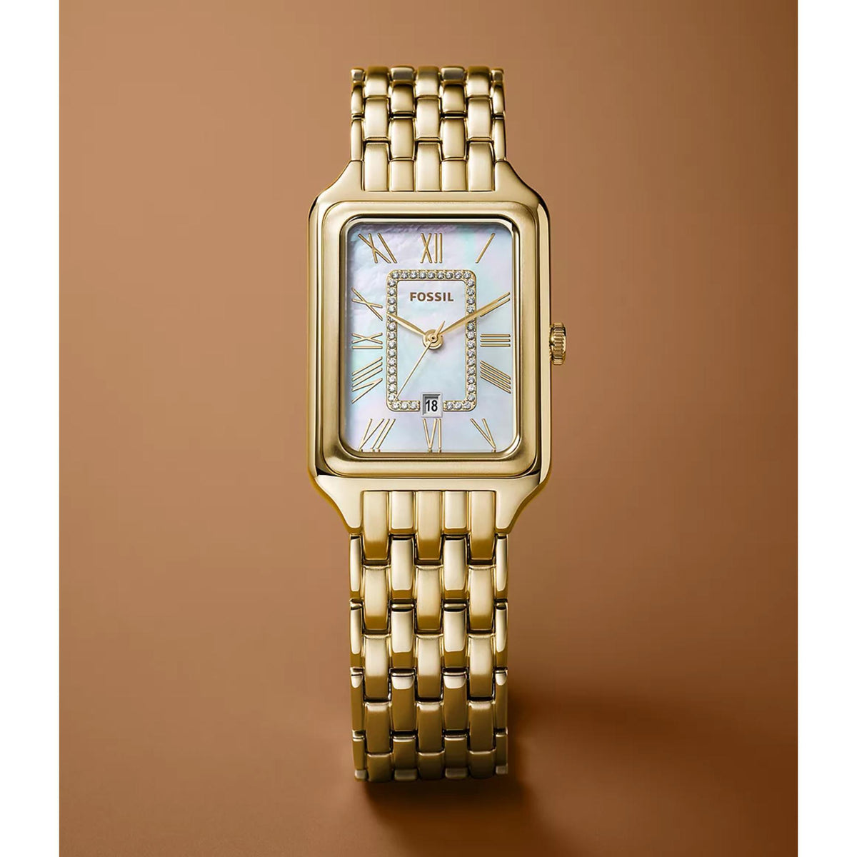 Front studio shot of the Fossil Raquel ES5304 watch showcasing the iridescent white mother of pearl dial and gold-tone Roman numerals