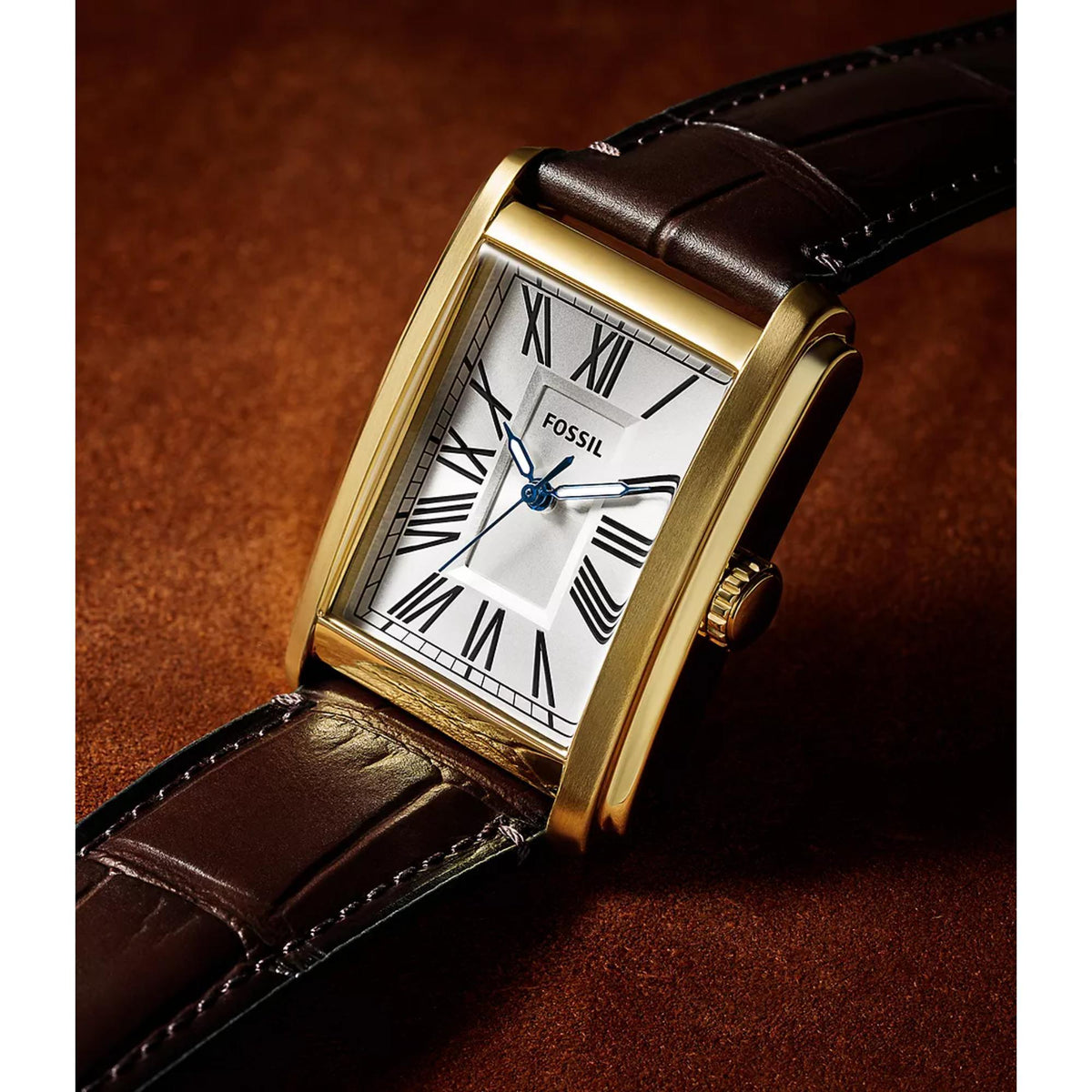 Close-up angled shot of the Fossil Carraway FS6011 wrist watch showcasing the silver dial with Roman numerals and gold-tone casing