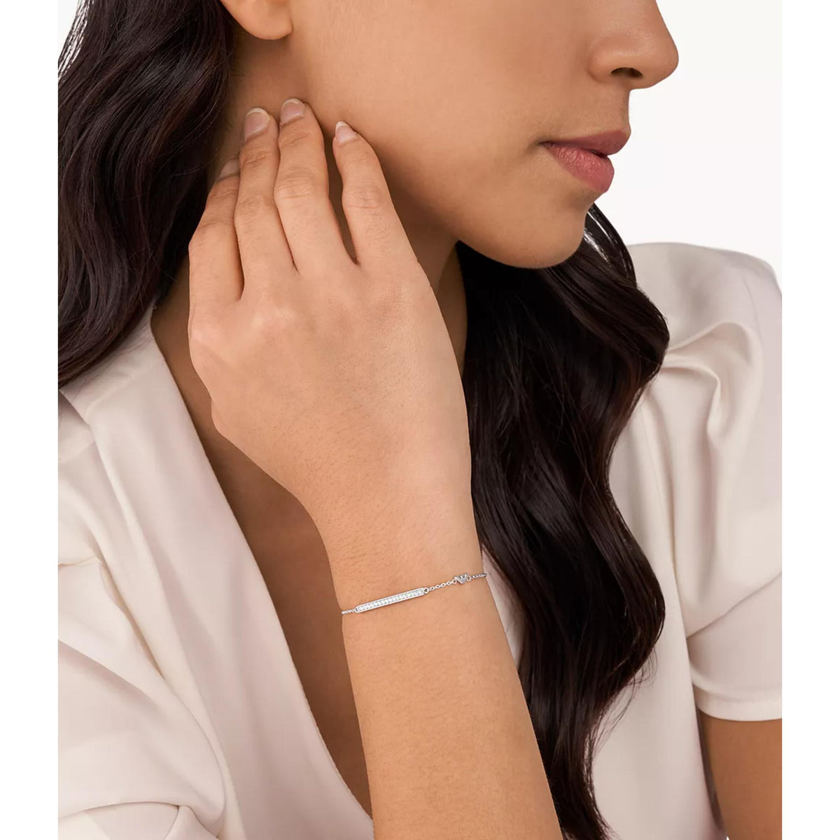 Sterling silver crystal bar bracelet worn on wrist with small clasp and chain links