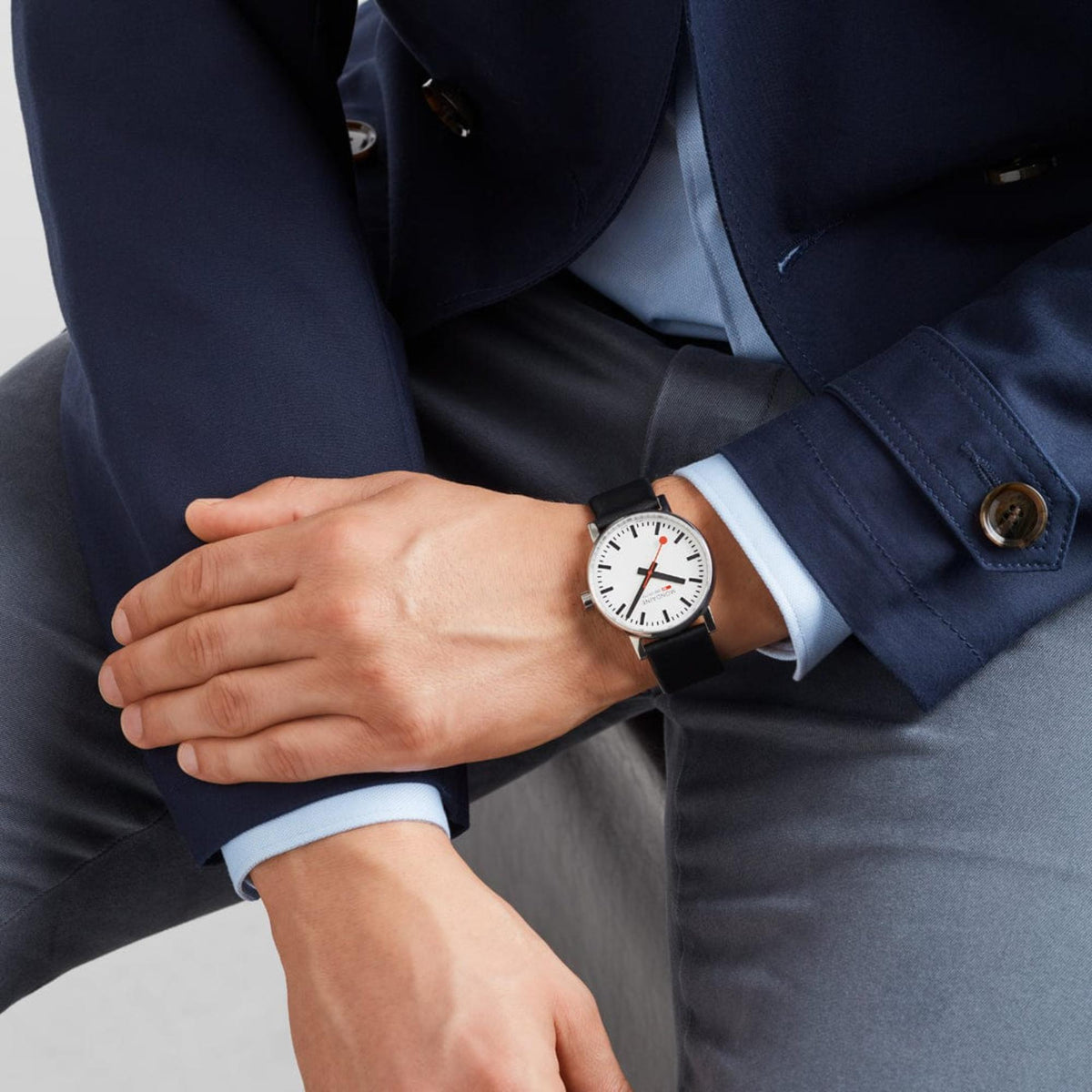 Mondaine Evo2 MSE.40110.LBV quartz timepiece worn on a wrist with a navy suit jacket