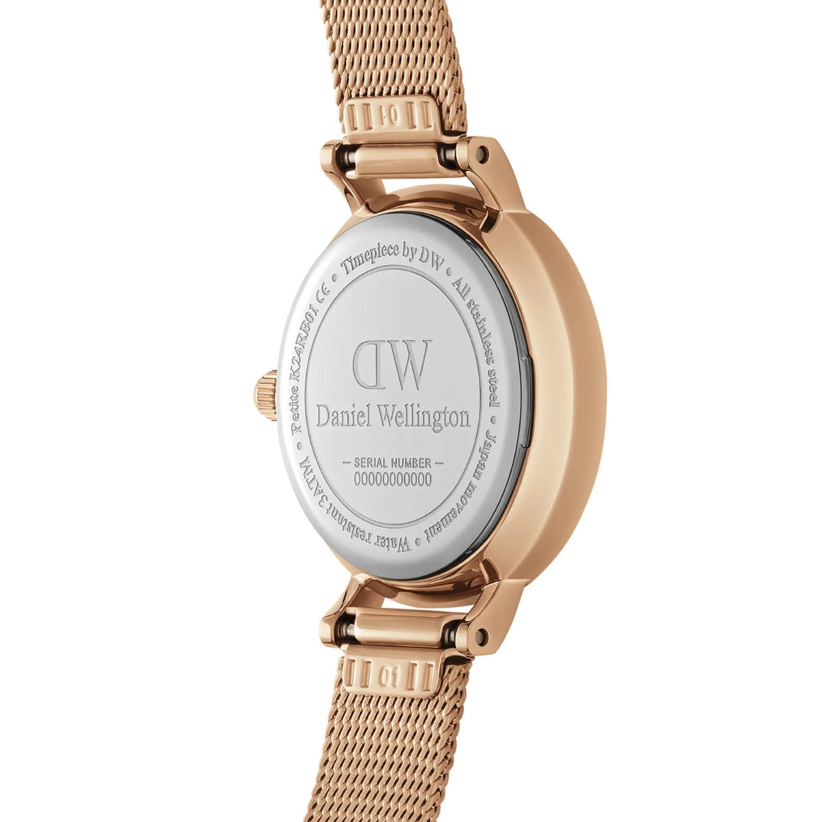 Rose gold caseback of ladies quartz watch with stamped DW logo and text
