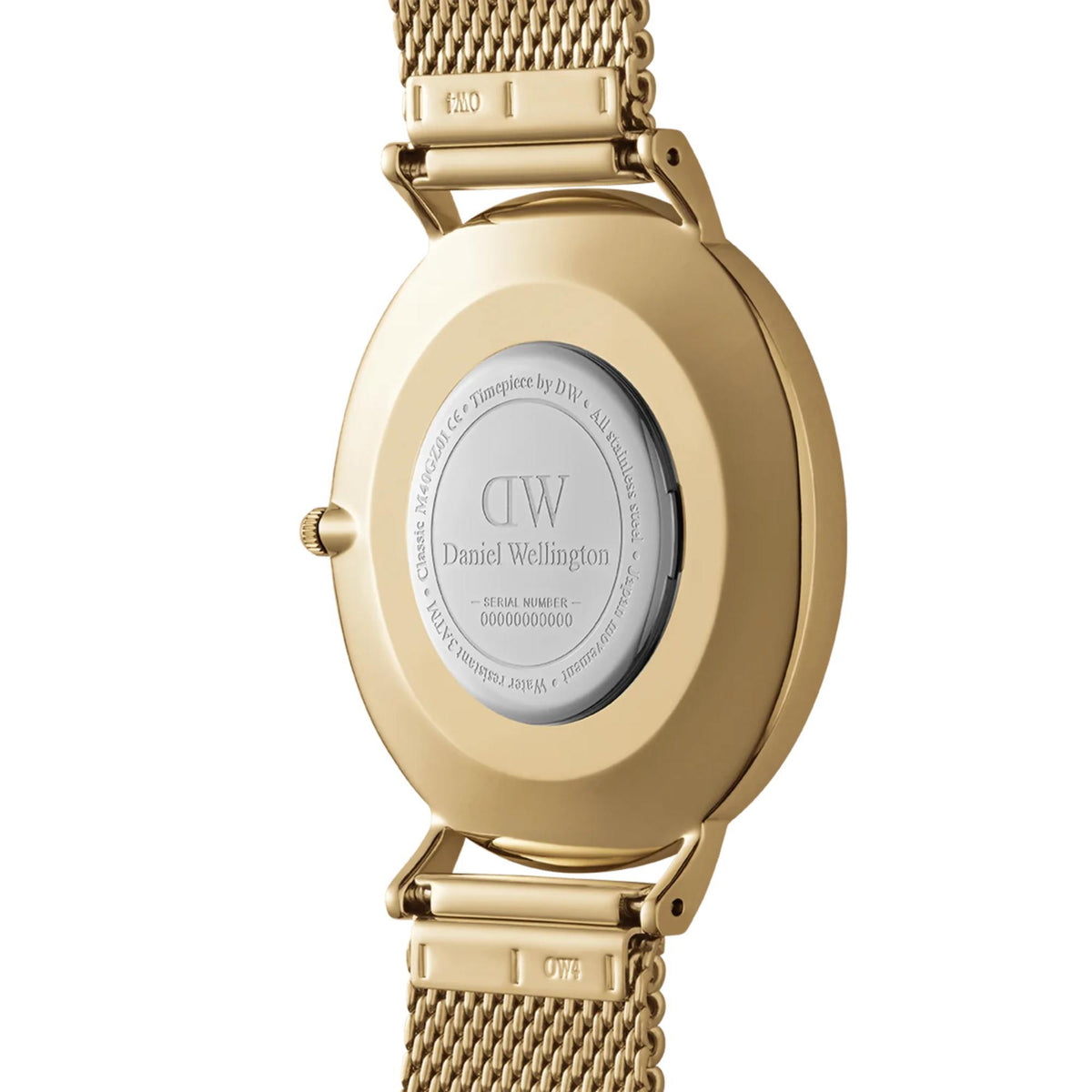 Gold-tone watch case back with mesh strap and engraved markings