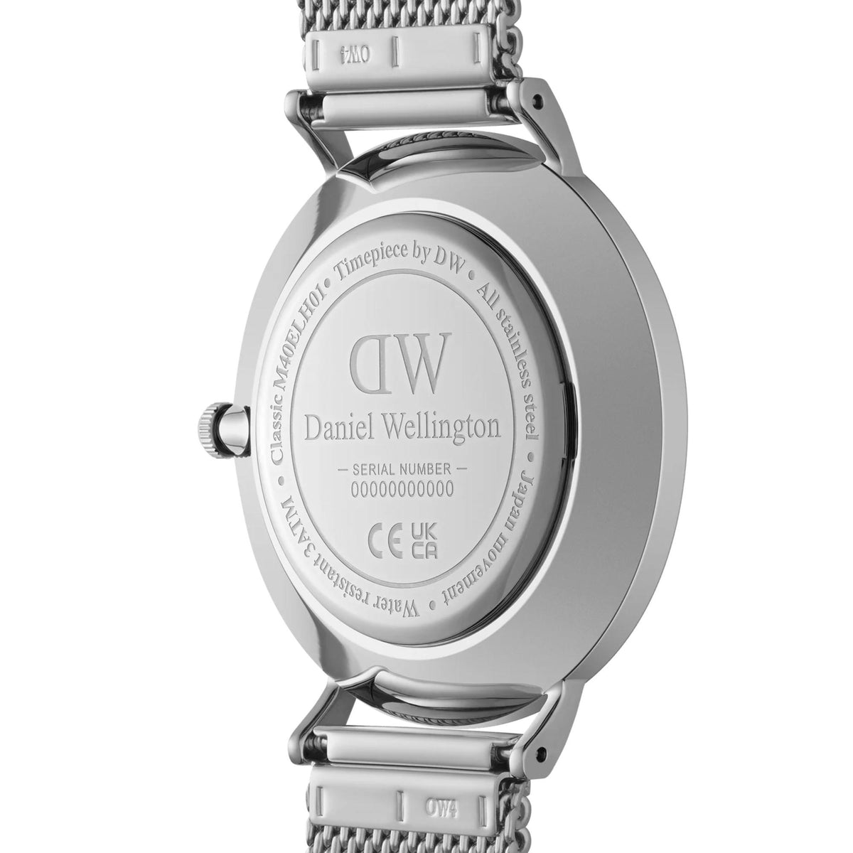 Daniel Wellington watch caseback in steel with engraved text and mesh bracelet clasp.