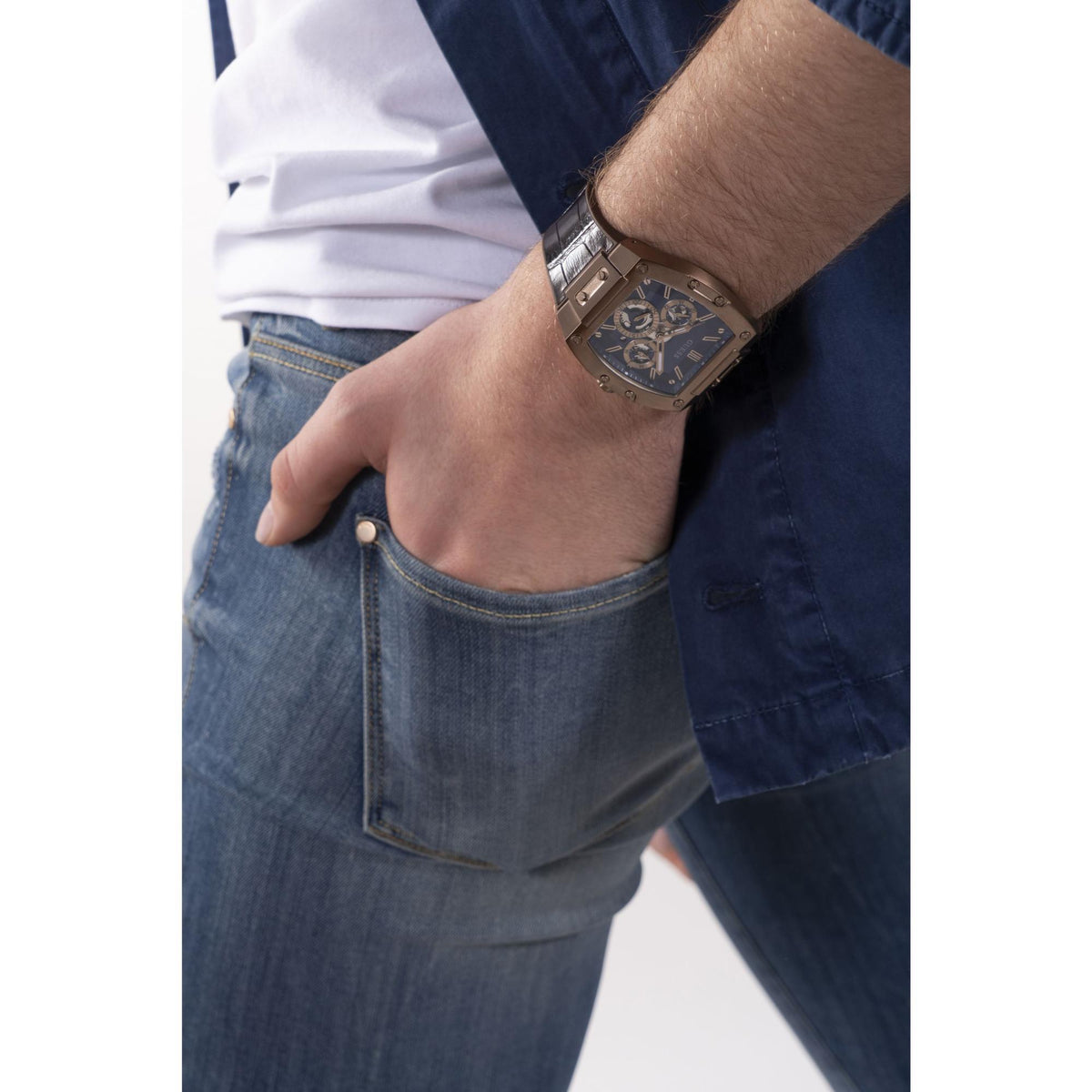 Men’s wrist wearing multifunction watch with blue dial and dark brown leather strap