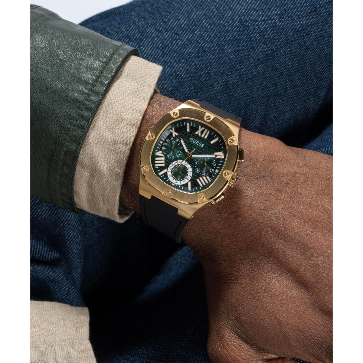 Men’s wrist watch with green dial and gold-tone case, black silicone strap