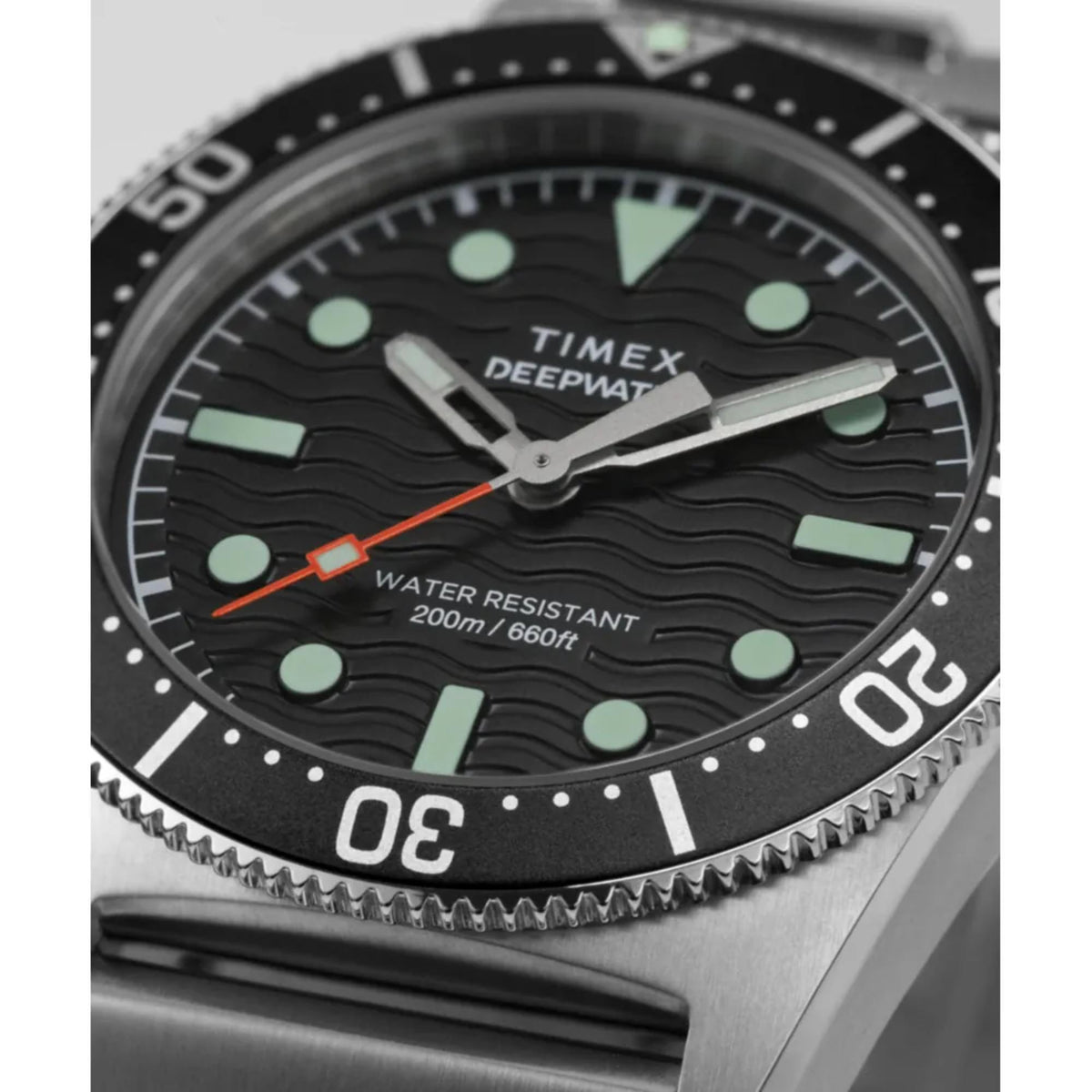 Black dial dive watch with orange seconds hand, green lume markers, water resistant 200m