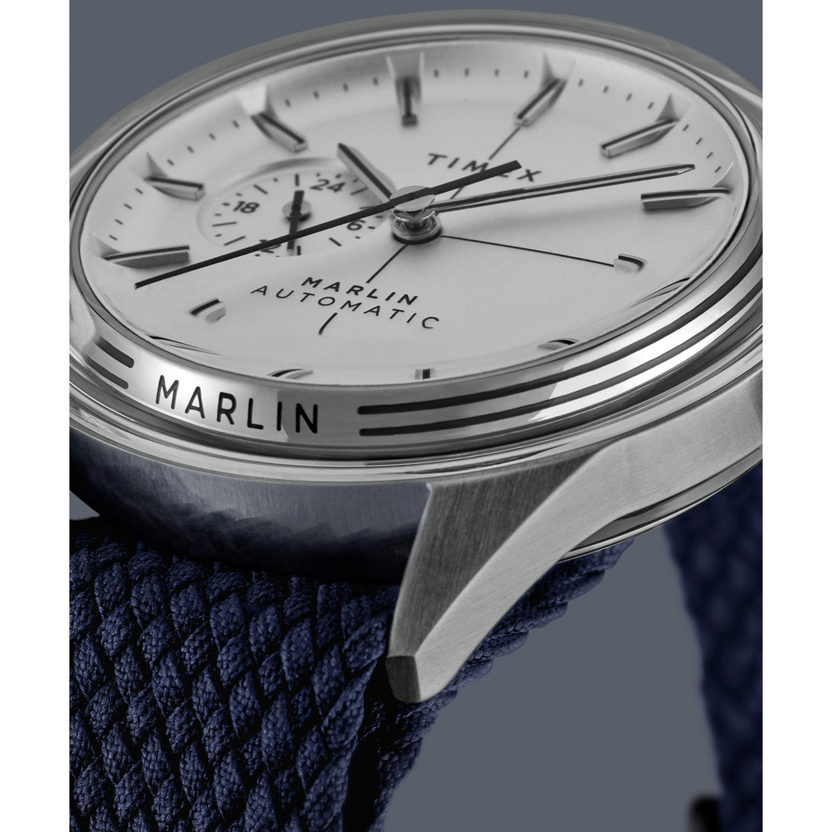 White dial with silver hands and markers, Marlin Automatic text close-up