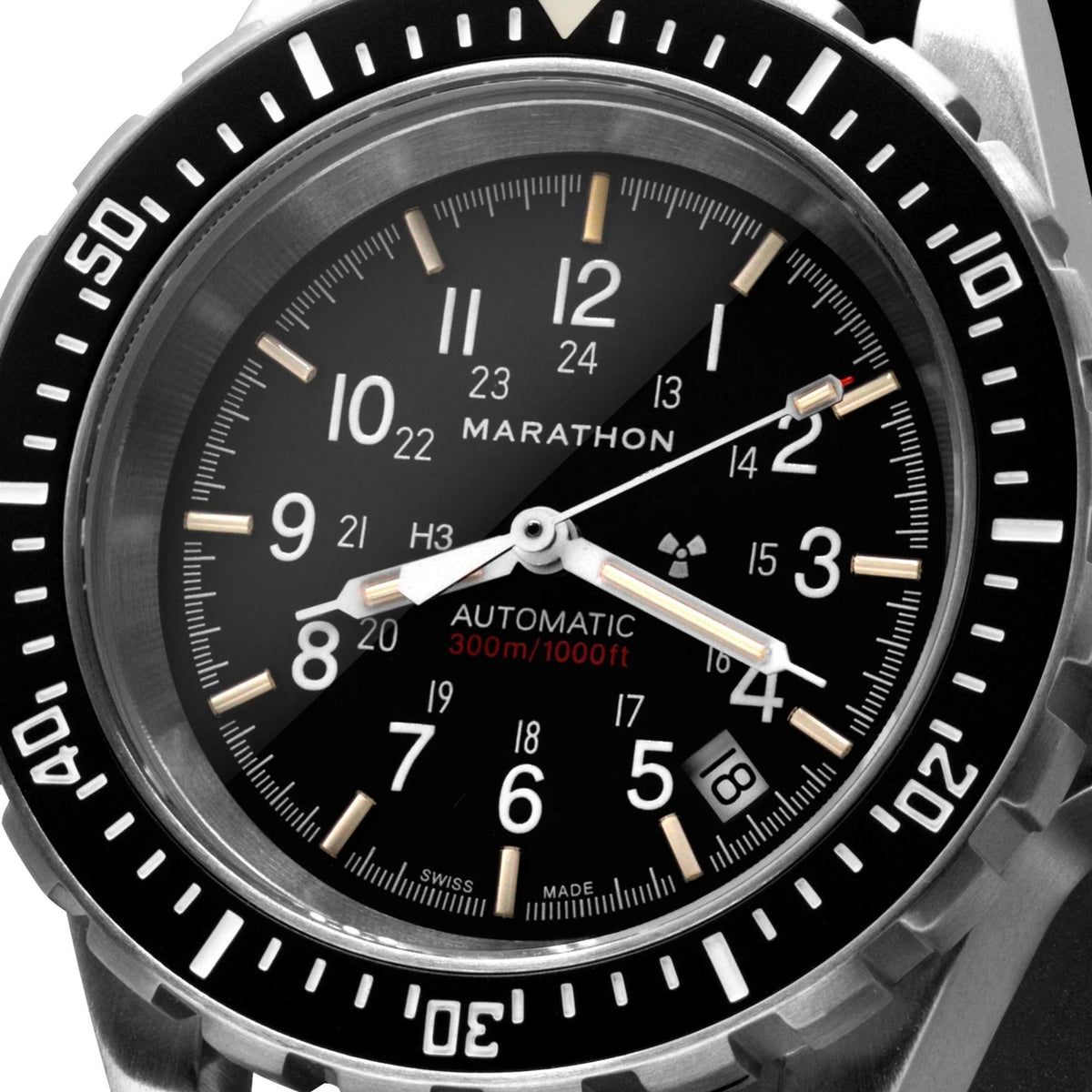 Close-up of men's diver watch black dial with silver hands, date window, and bezel