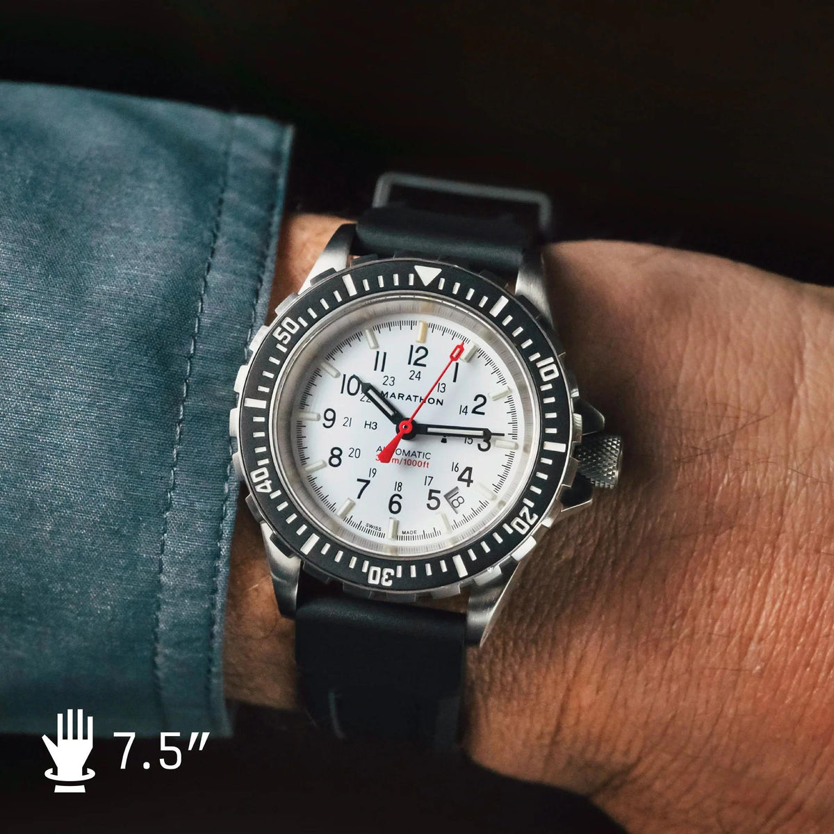 Men’s wrist dive watch with white dial, black bezel, and black rubber strap