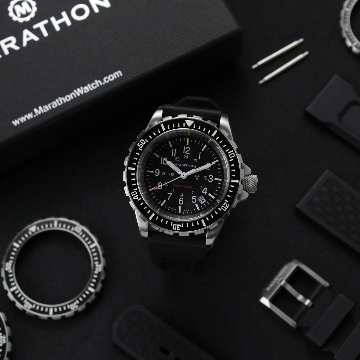 Men’s diver quartz watch with black dial, three subdials, and black rubber strap.