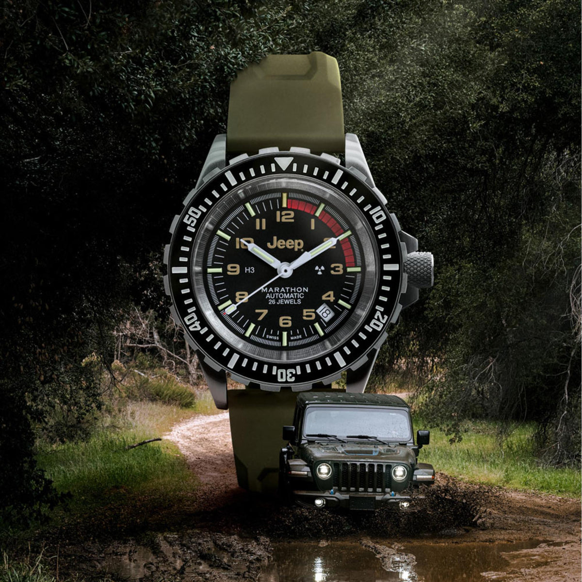 Men's stainless steel diver watch outdoors on olive strap, black dial with red accents