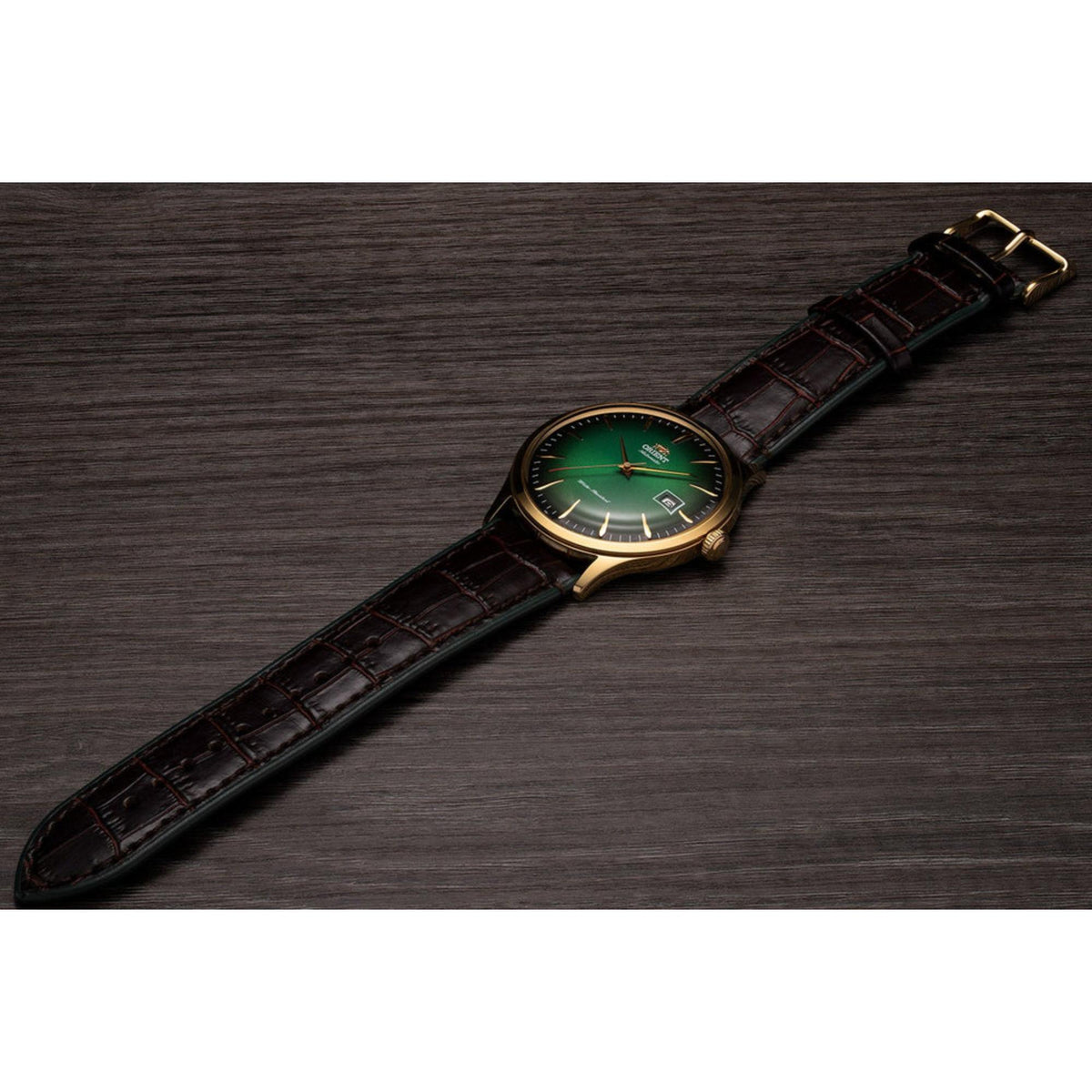 Orient Bambino green dial automatic watch on dark brown leather strap