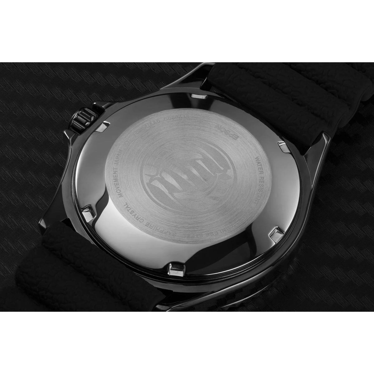 Stainless steel caseback of men's diver watch with black silicone strap
