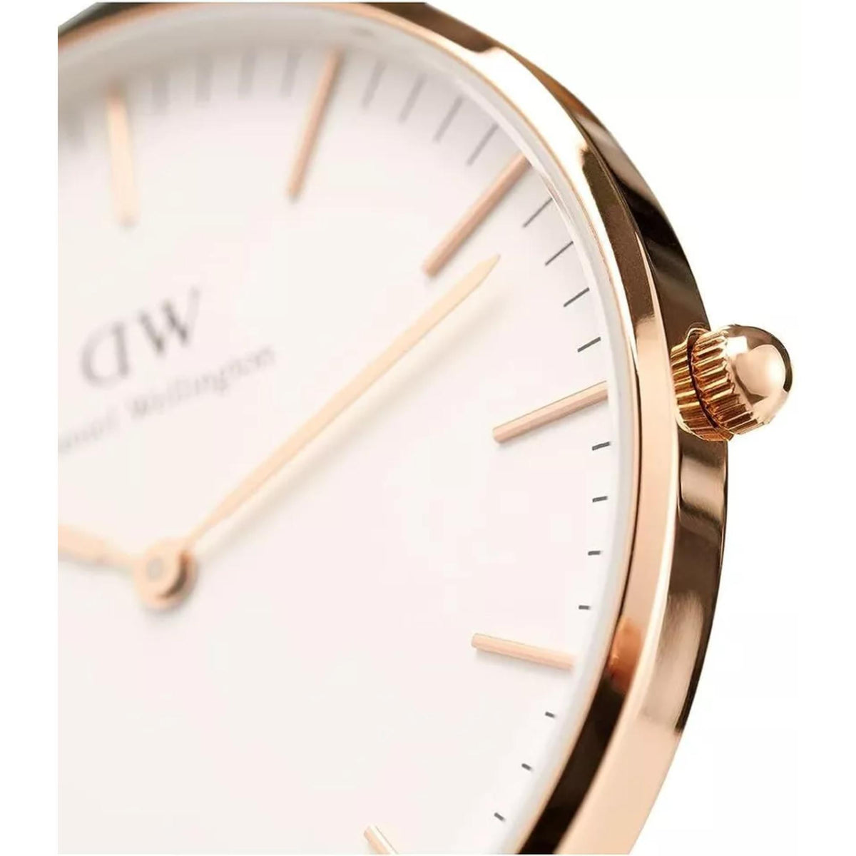 Daniel Wellington men's quartz watch crown detail on rose-gold case and white dial