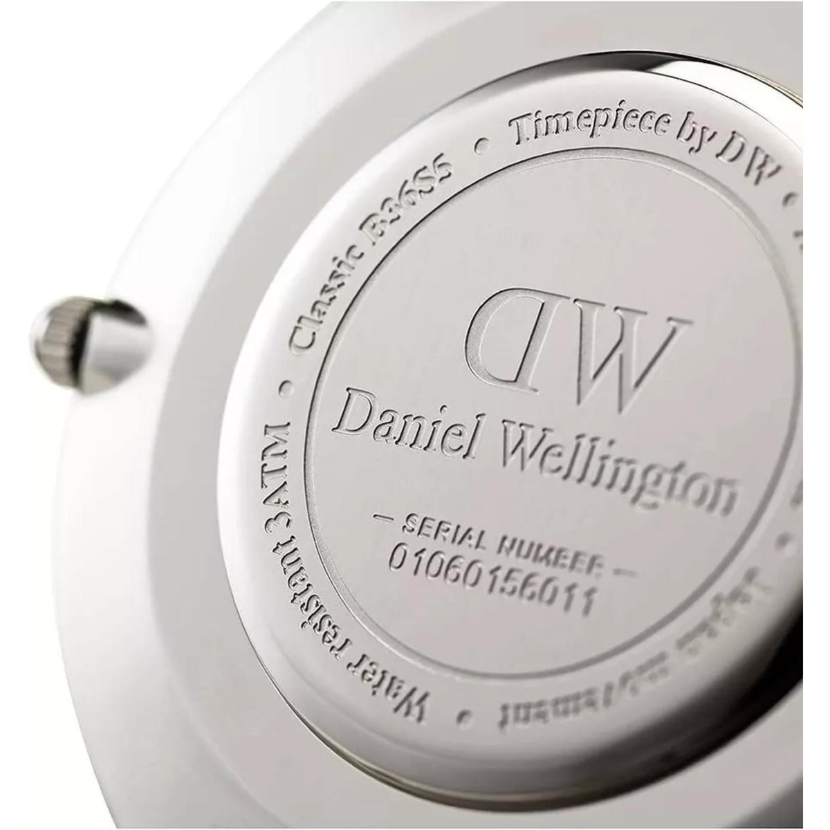 Daniel Wellington men's quartz watch case back with DW logo and serial markings