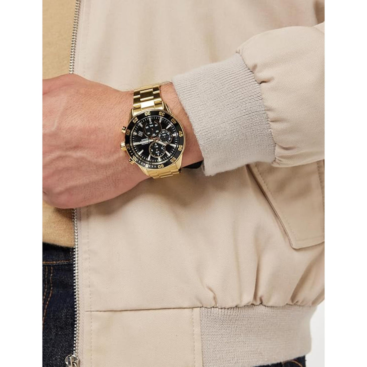 Men's gold-tone chronograph watch on wrist with black dial and multiple subdials