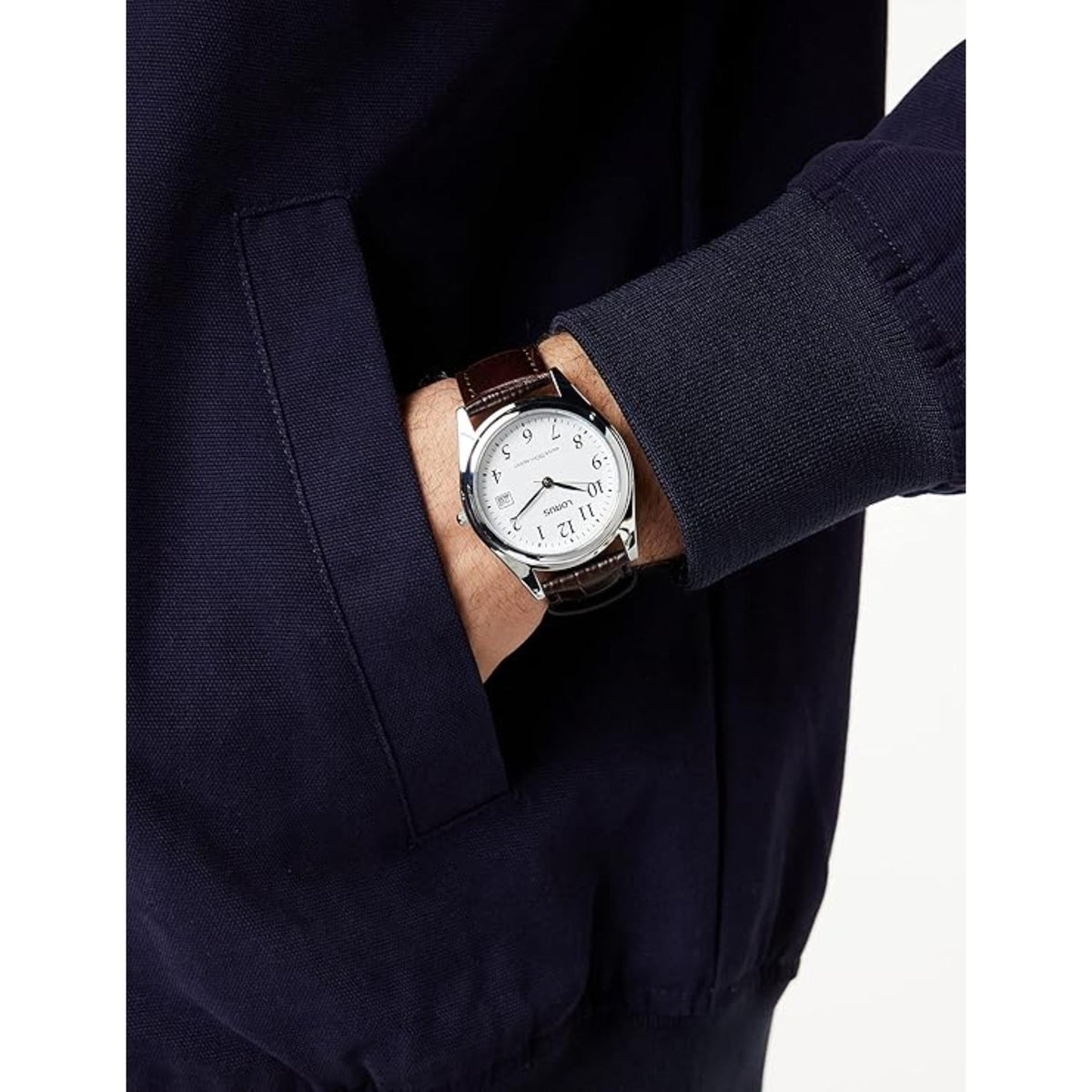Men's Lorus analog quartz watch on wrist, white dial, brown leather strap.