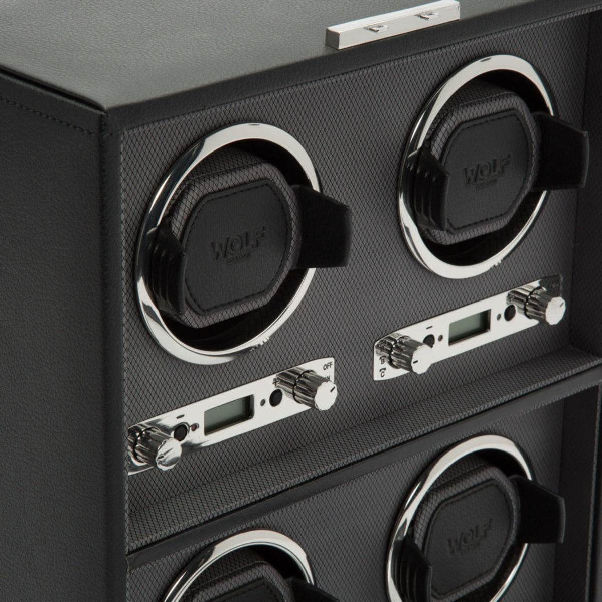 Black watch winder with chrome-ring watch holders and control dials inside