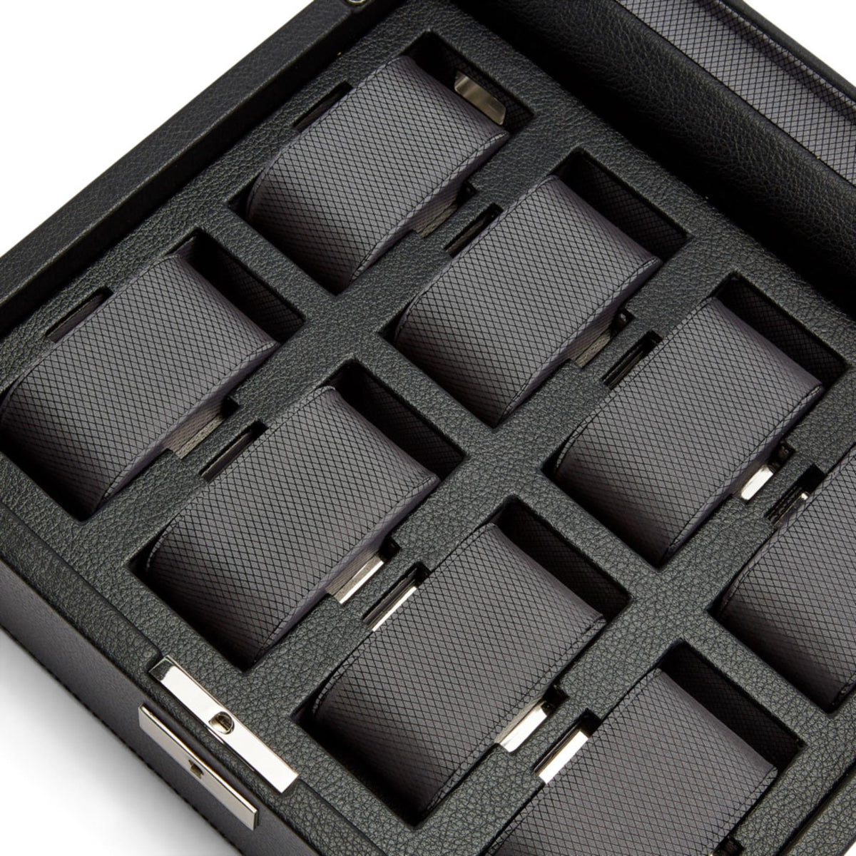 Padded watch insert grid with textured compartments and divider slots inside the box