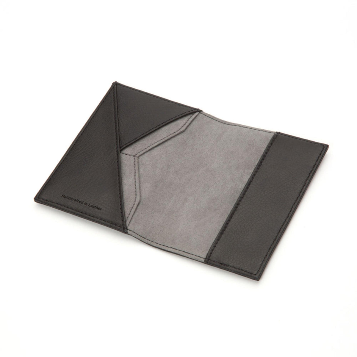 Black leather passport holder with gray interior lining shown open