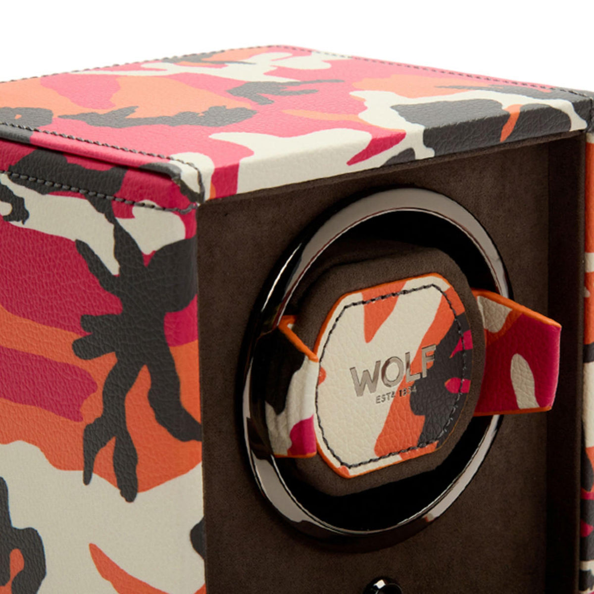 Close-up of single watch winder circular winder with camouflage strap and WOLF label