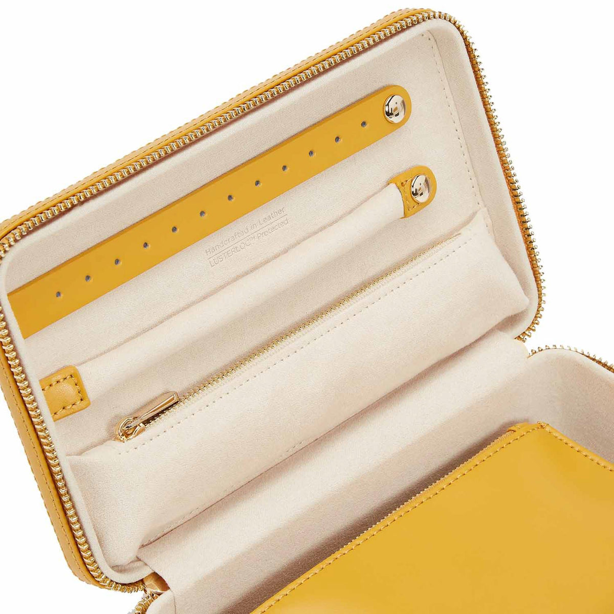 Mustard yellow zip case interior with card slots and gold-tone snap hardware