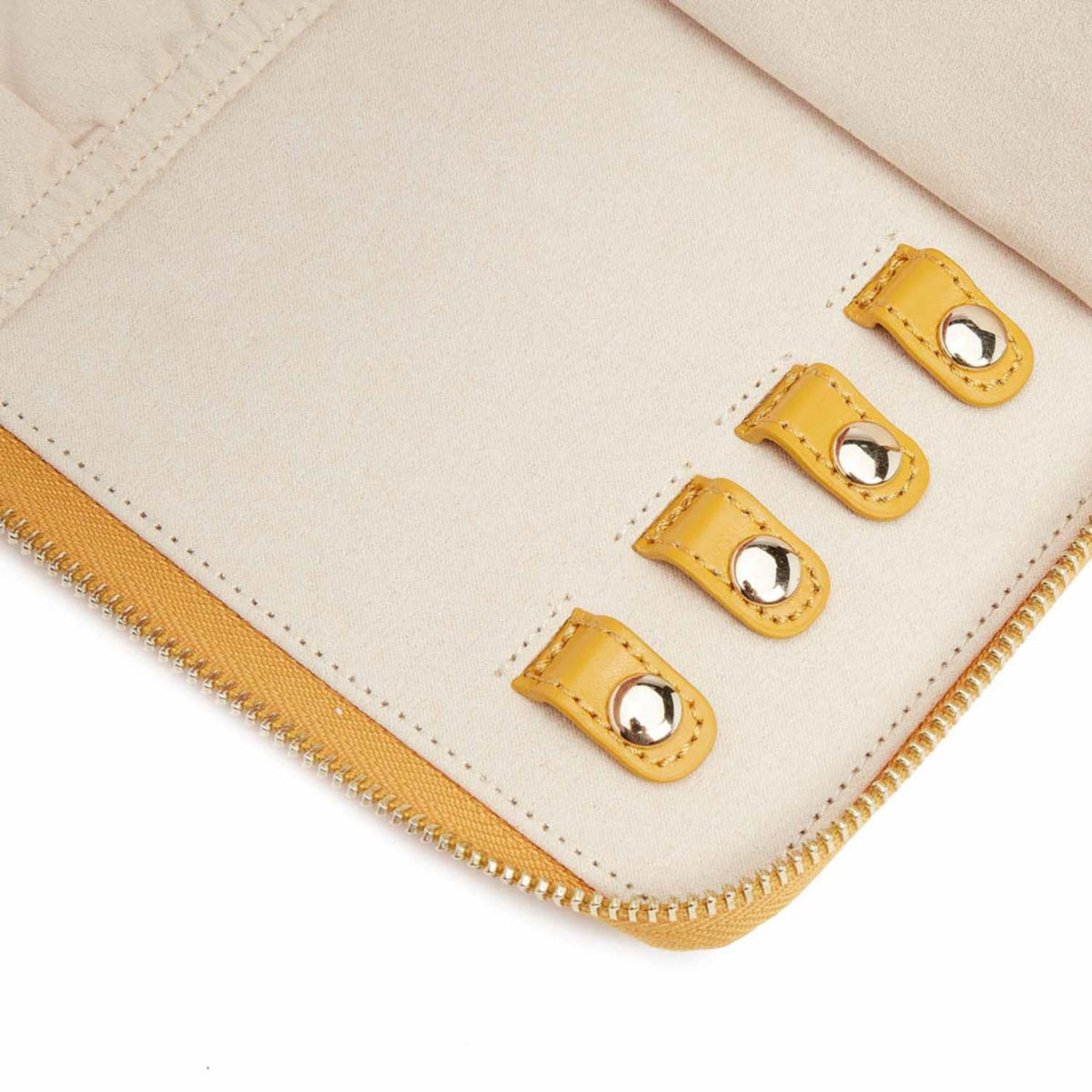 Beige interior with mustard trim, snap button closures, and stitched edge details