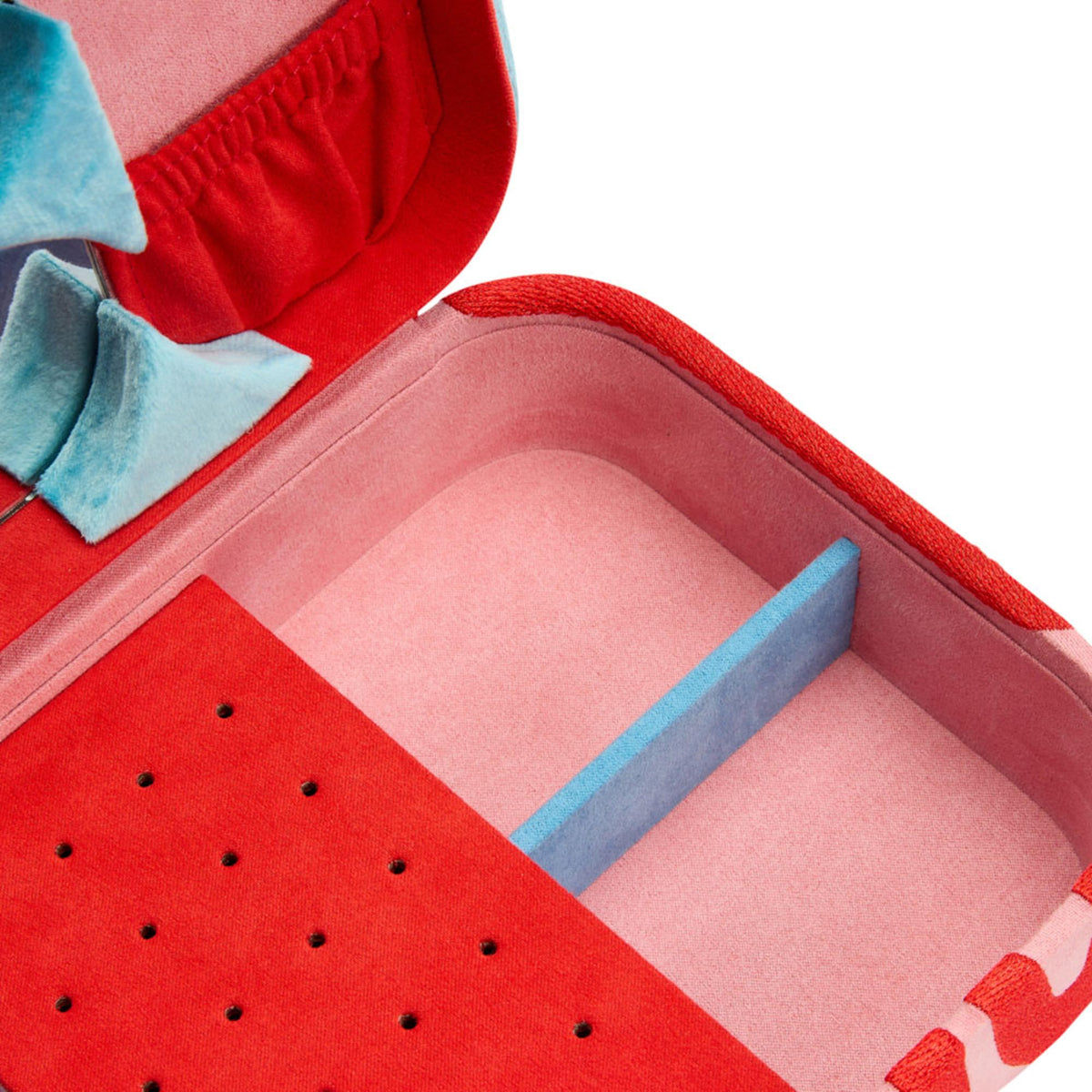 Medium jewelry box interior close-up; pink base with blue sidewalls and red organizer insert